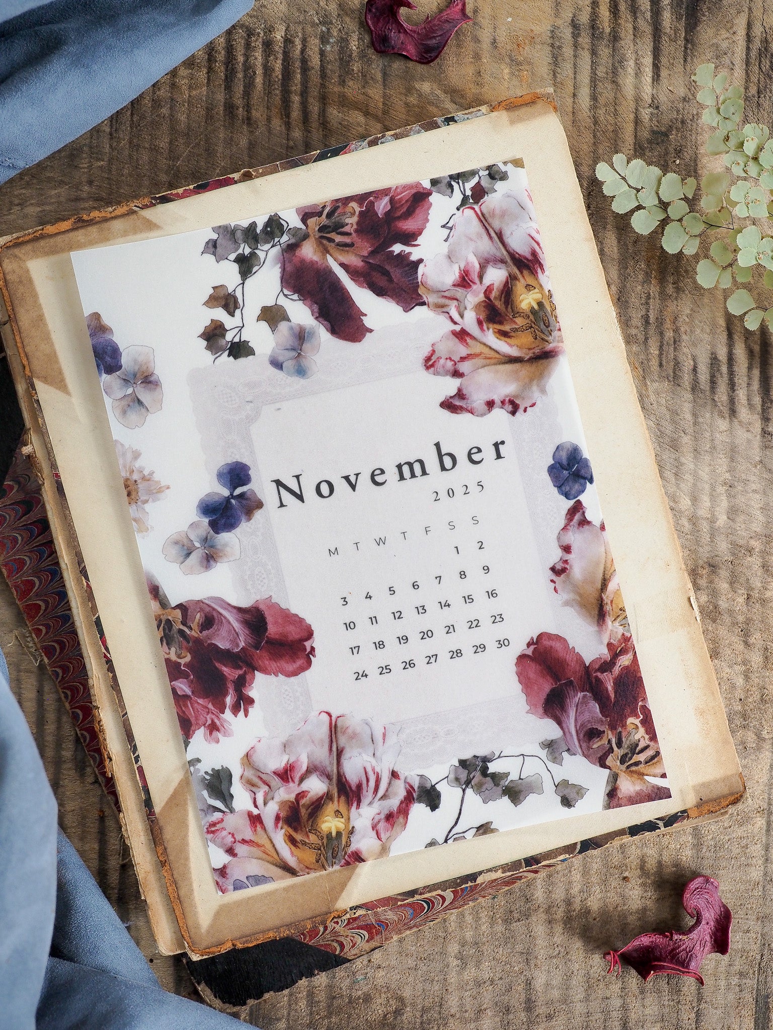 Decorative B6 November 2025 monthly calendar adorned with beautiful watercolor floral art in shades of dusty rose, deep burgundy, and soft cream.
