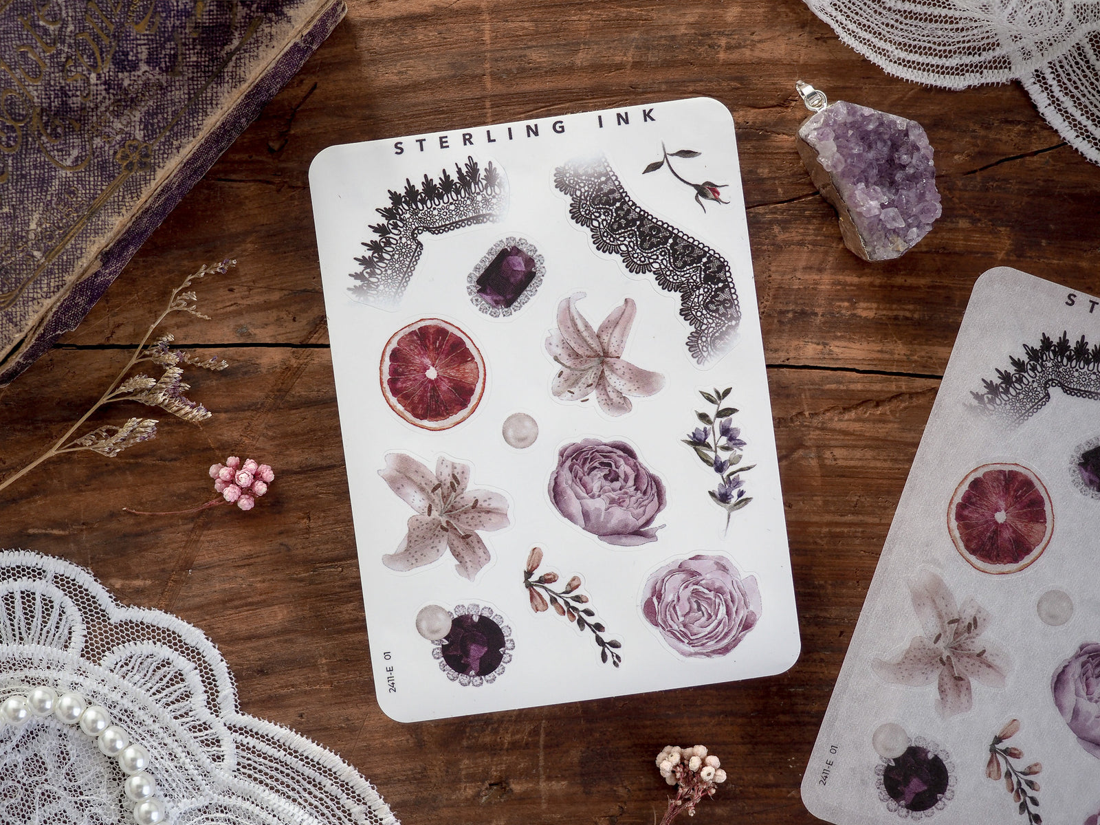 Elegant 'Elements Stickers - November 2024' sheet displaying various botanical motifs, including detailed illustrations of dried roses, sliced blood oranges, and assorted natural flora.