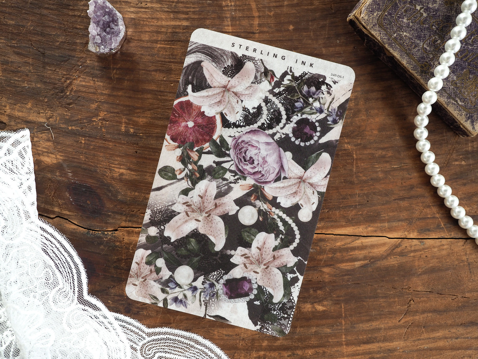Moody floral deco sheet featuring delicate white blossoms and dramatic deep plum roses surrounded by lush green foliage and dark accents.