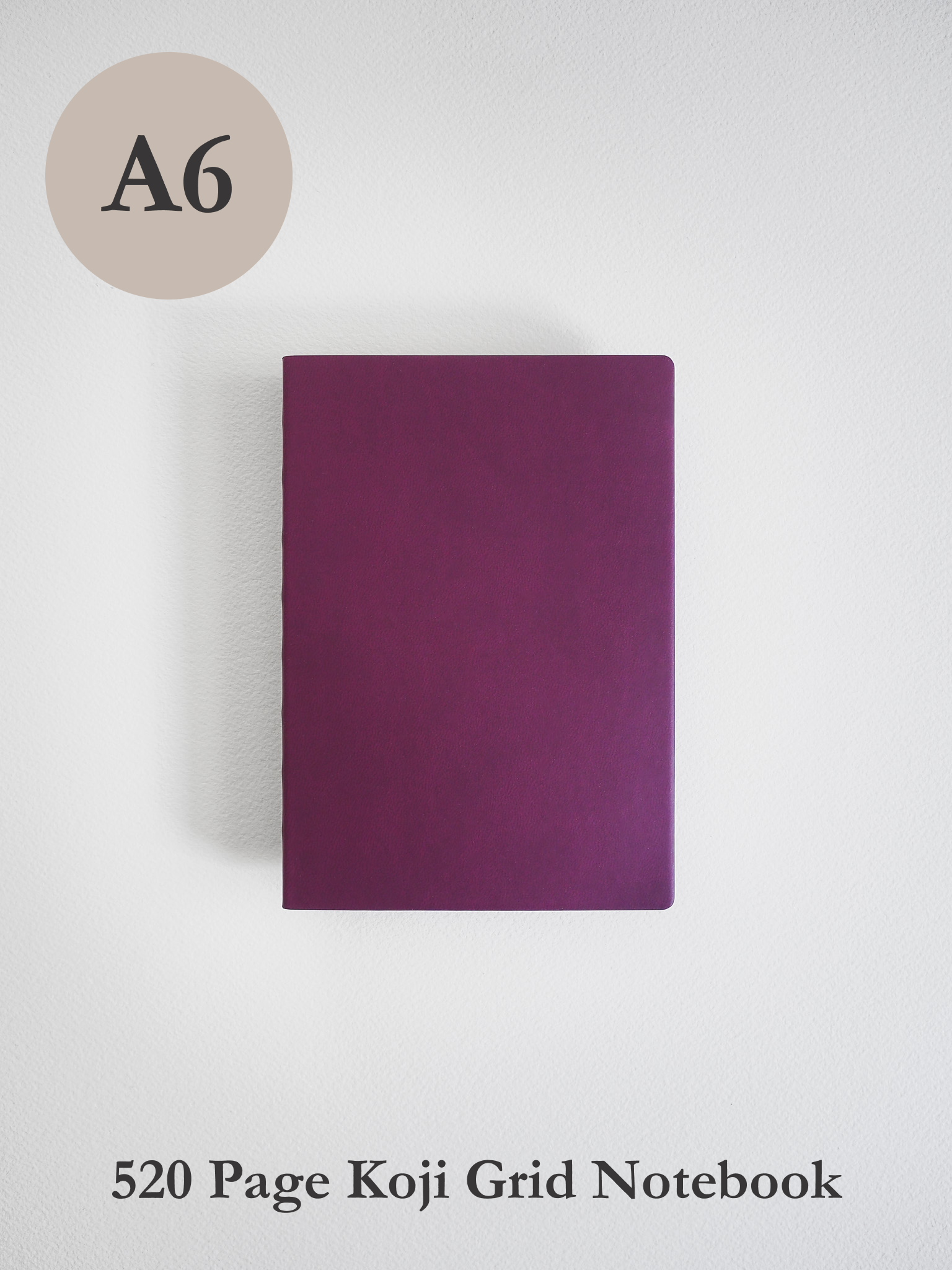 A solid, deep mauve A6 notebook cover, featuring a minimalist design ideal for journaling or structured writing.