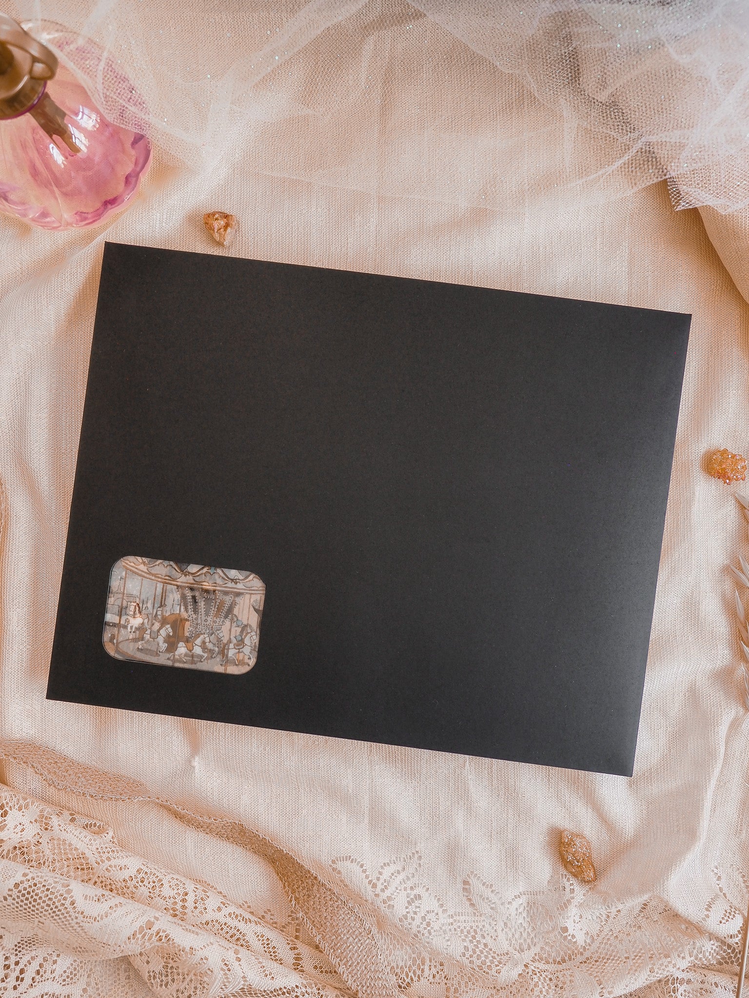 Black subscription kit planner featuring a small, distressed label with sepia-toned, antique script and vintage design elements.