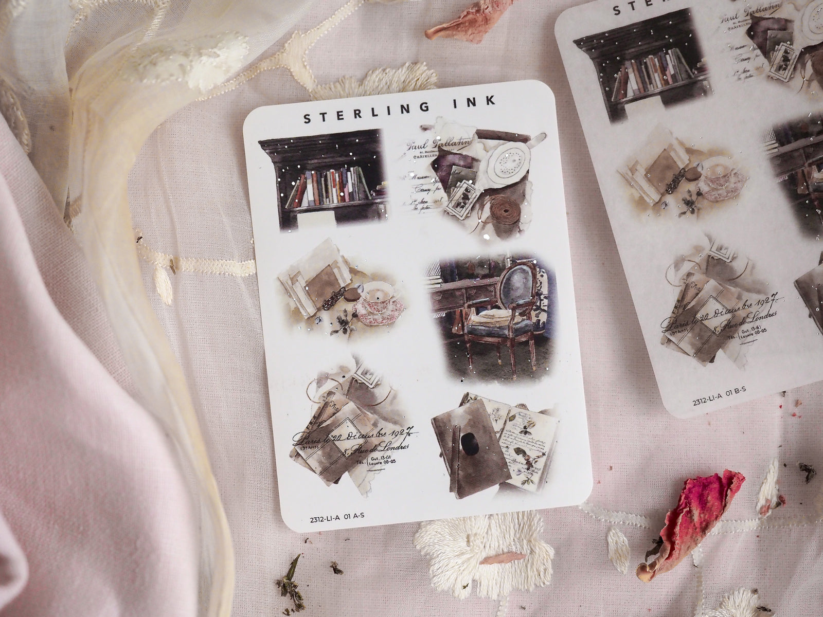 Large icon sticker set with silver foil accents, featuring vintage monochrome designs like stacks of books, framed photos, letters, and decorative ephemera.