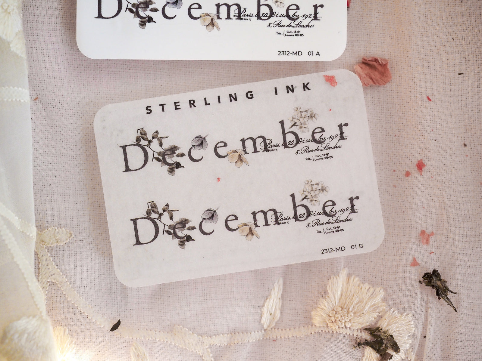 Pristine white labels featuring large, ornate dark lettering of "December" and coordinating calendar dates, perfect for vintage journaling and elegant scrapbooking.