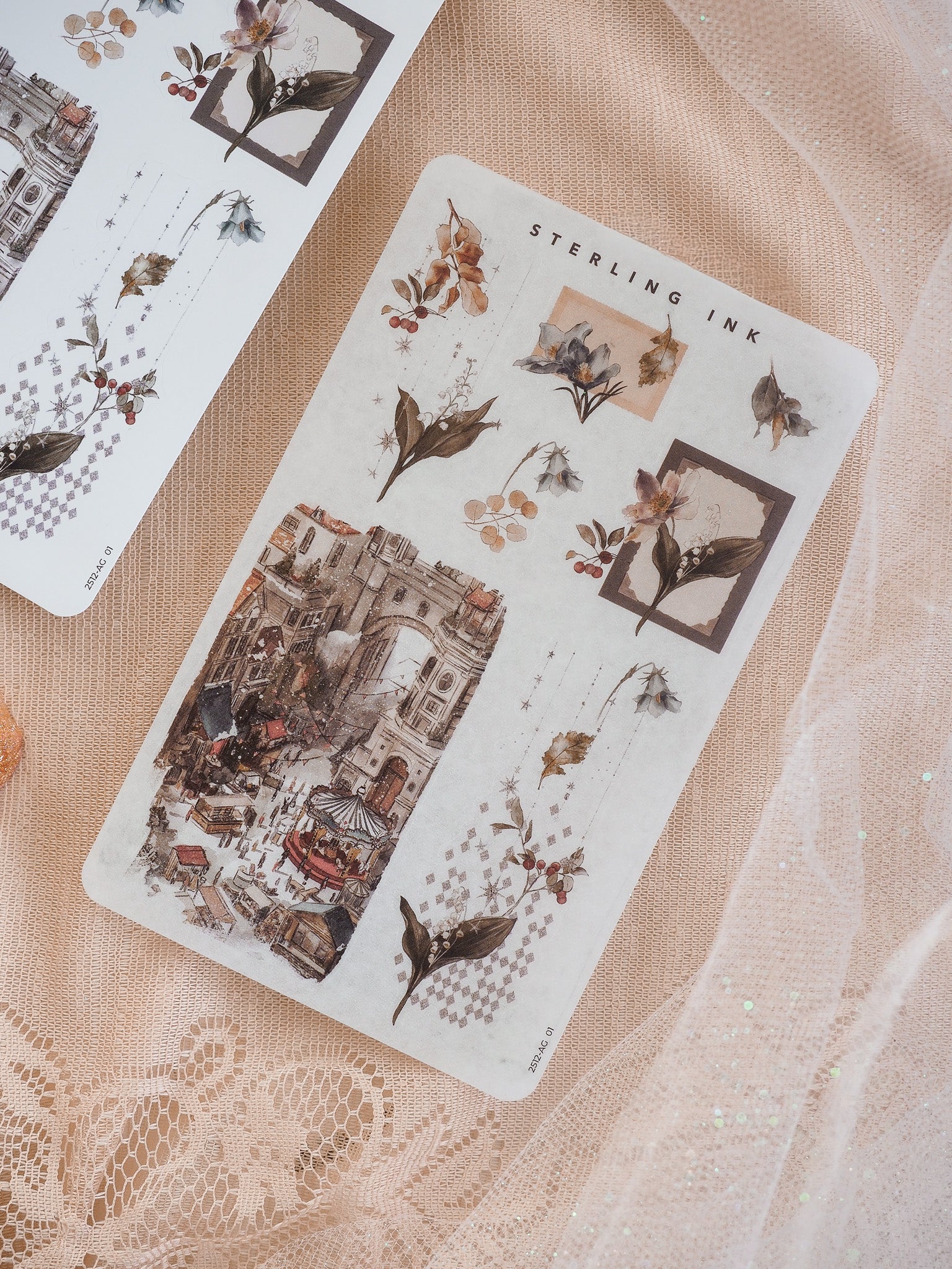 Vintage arrangement stickers for December 2025 featuring intricate botanical motifs, decorative typography, and a detailed, rustic European street market scene.