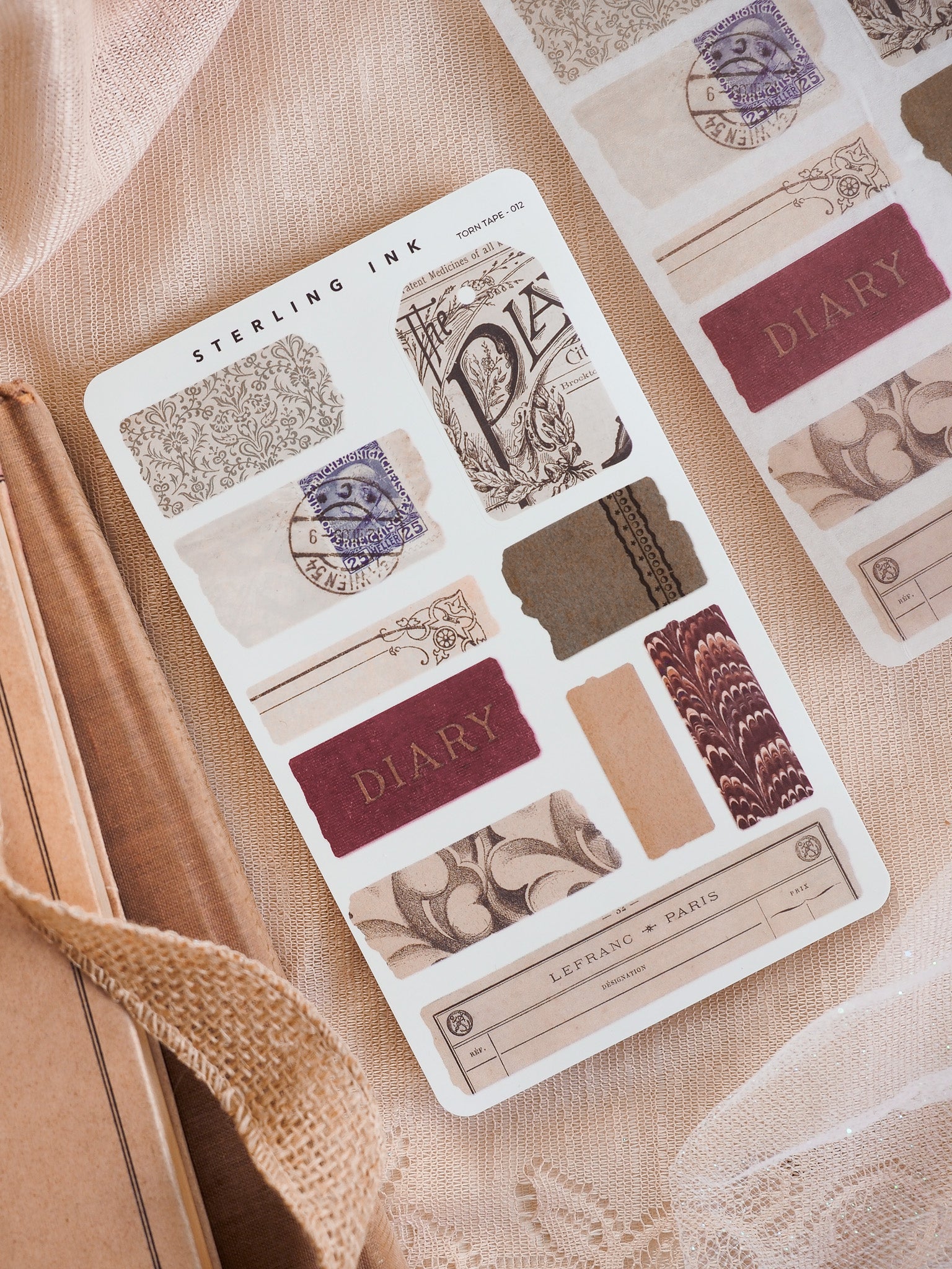Ephemera-style torn tape stickers for journaling, displaying vintage blue postmarks, faded sepia borders, and "Paris" labels for scrapbooking accents.