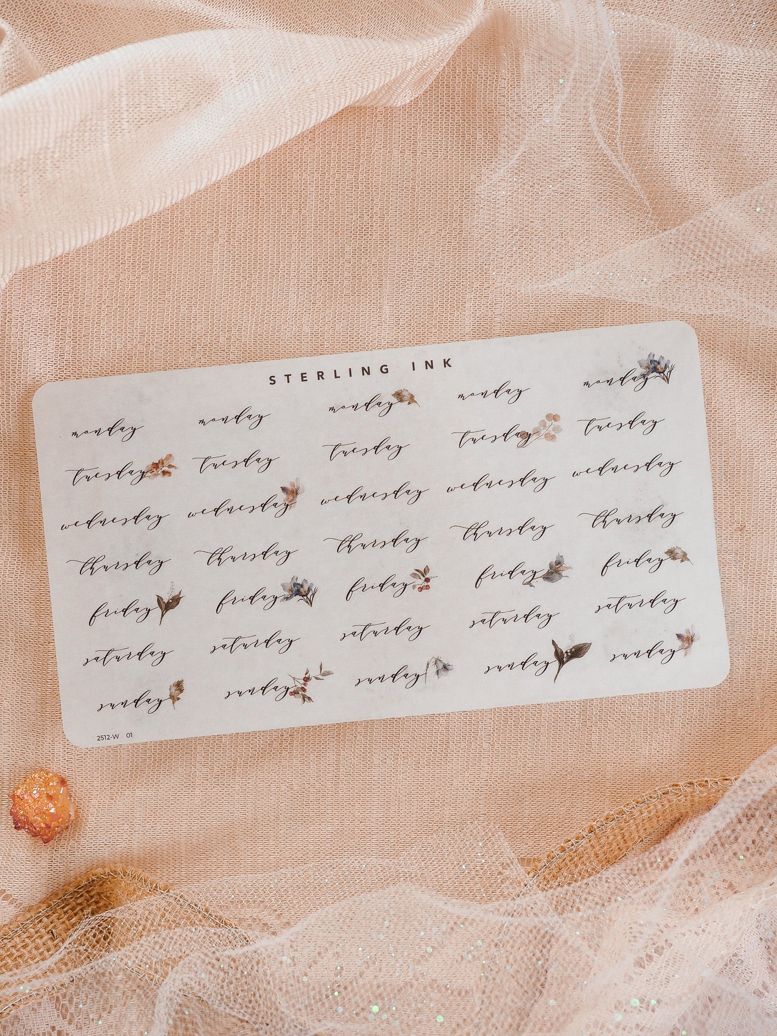 An organized sheet of white planner stickers featuring the theme "Weekday" and decorated with delicate watercolor leaves and floral motifs for journaling.