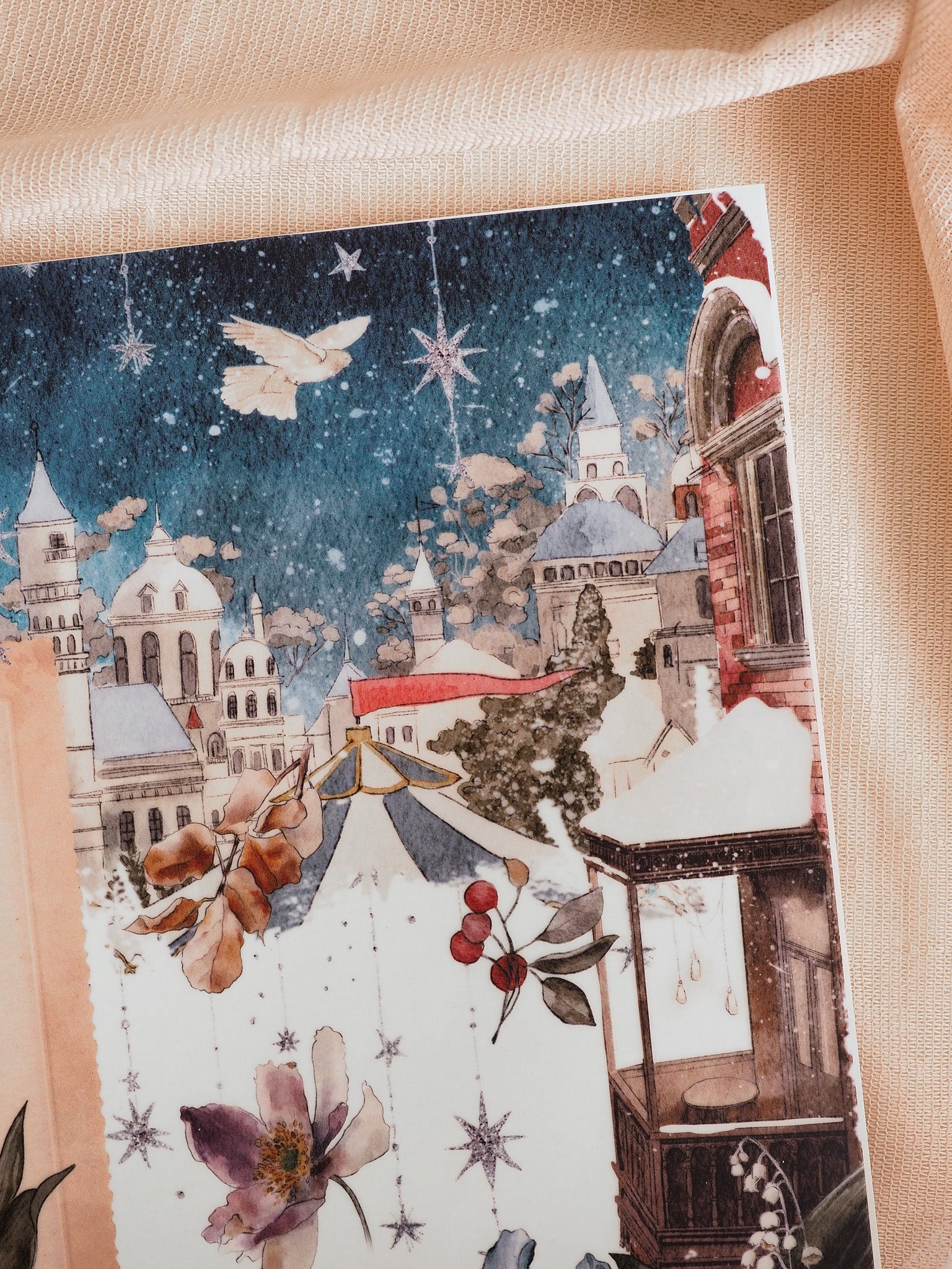 A richly detailed December illustration of a snowy European Christmas market at night, featuring historic architecture, falling snowflakes, and red berries.