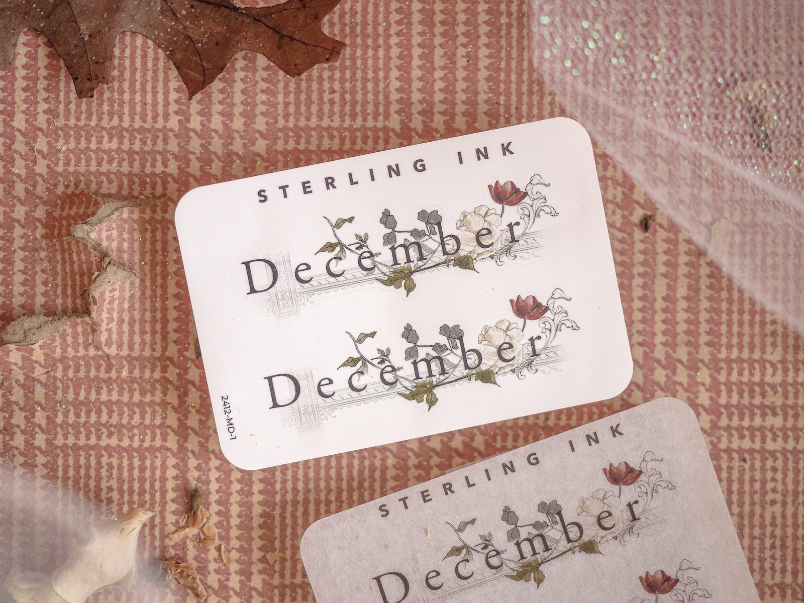 Vintage December month sticker for planners, featuring delicate printed florals and the elegant "December" text, perfect for journaling.