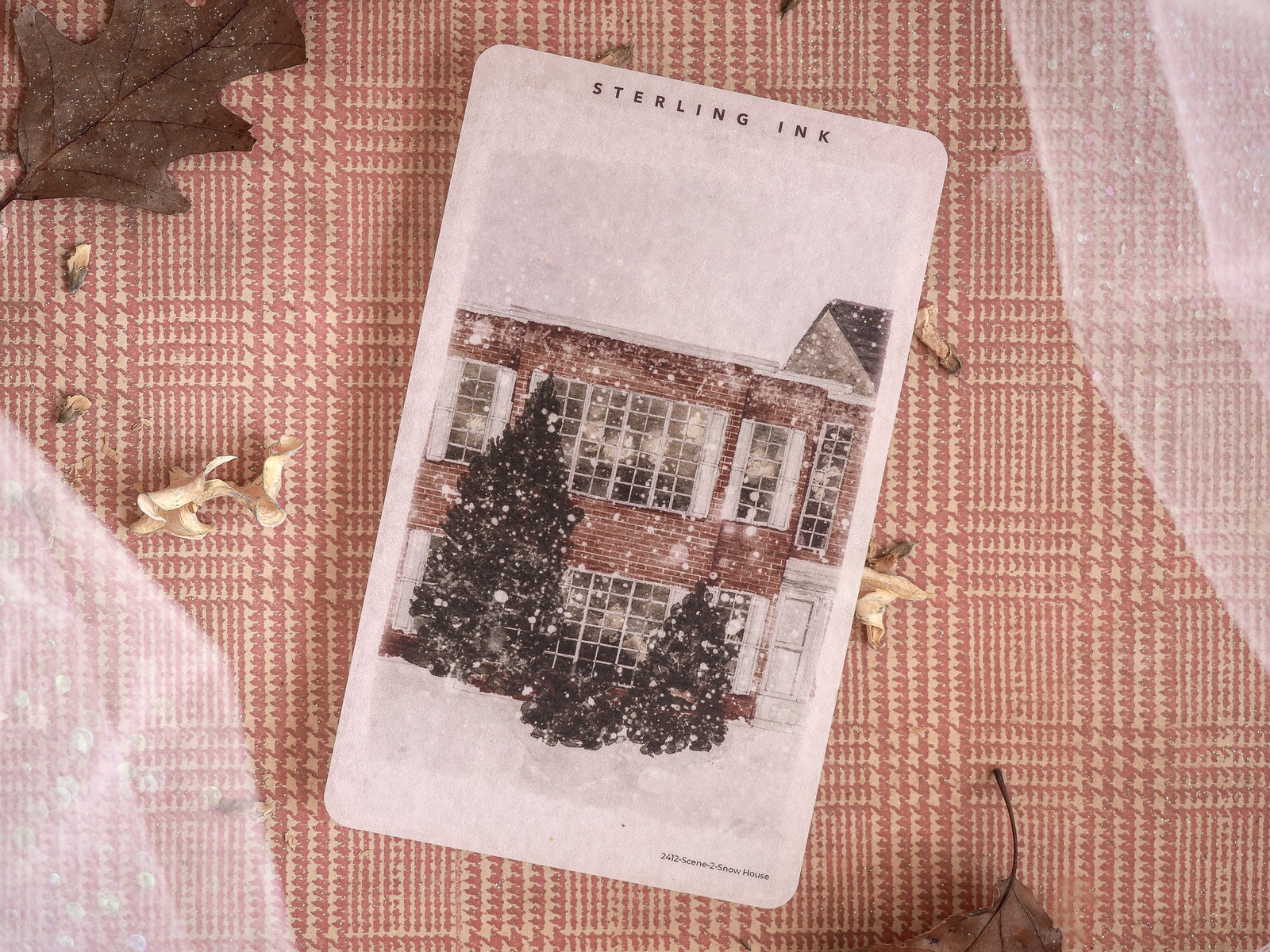 Vintage monochrome art featuring a detailed, snow-dusted Victorian house, making it a seasonal graphic for winter journaling or scrapbooking.