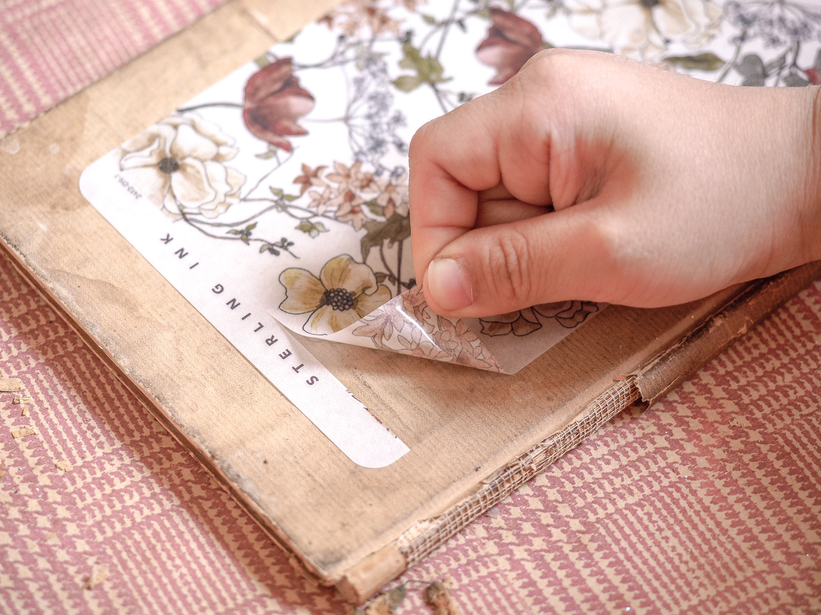 Vintage deco sheet for December 2024, displaying a detailed botanical pattern with rich, muted floral designs in creams, browns, and soft rust tones.