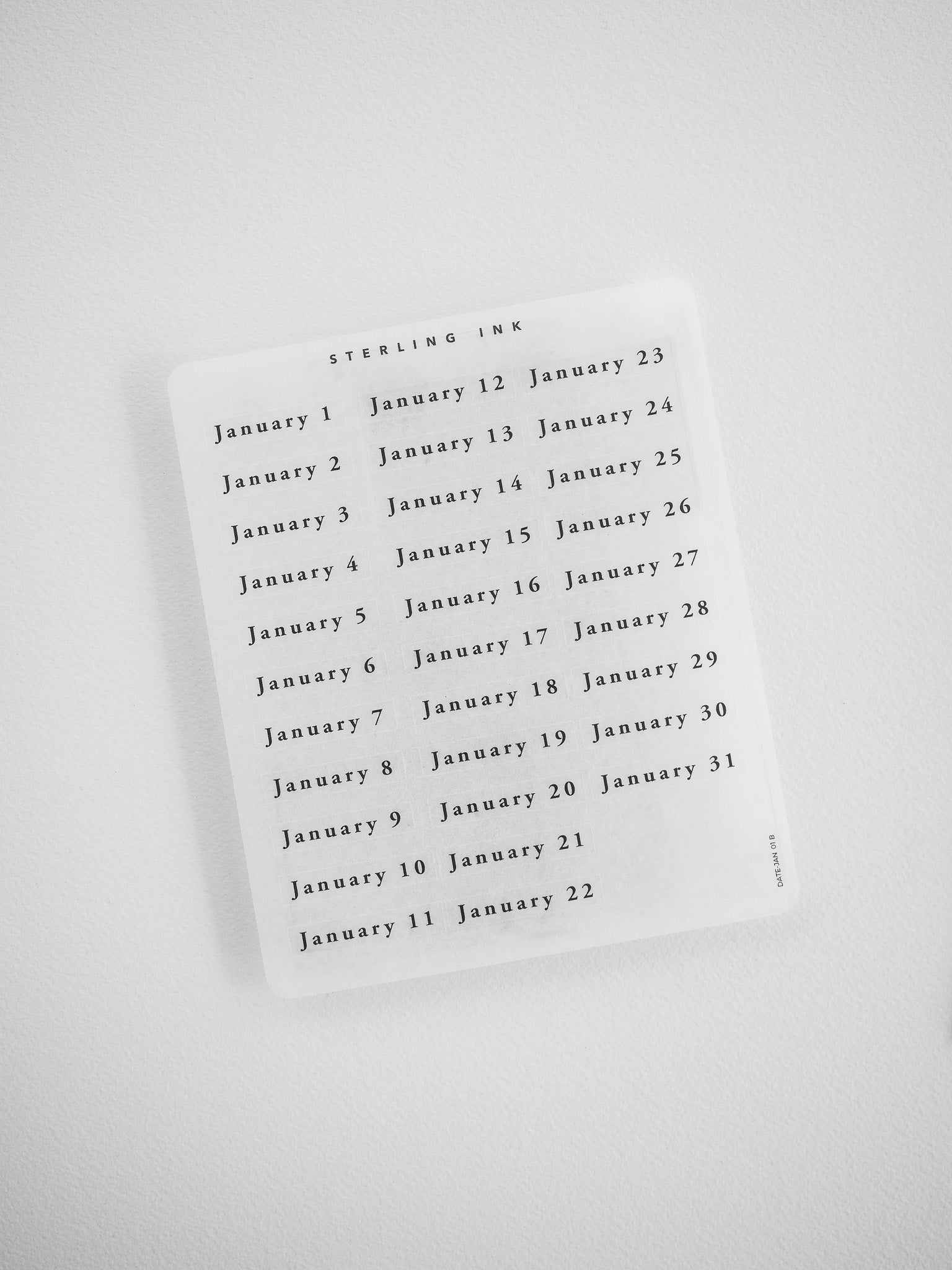 A comprehensive sticker sheet displaying daily date blocks for an entire year, designed for year-at-a-glance planning and scheduling organization.