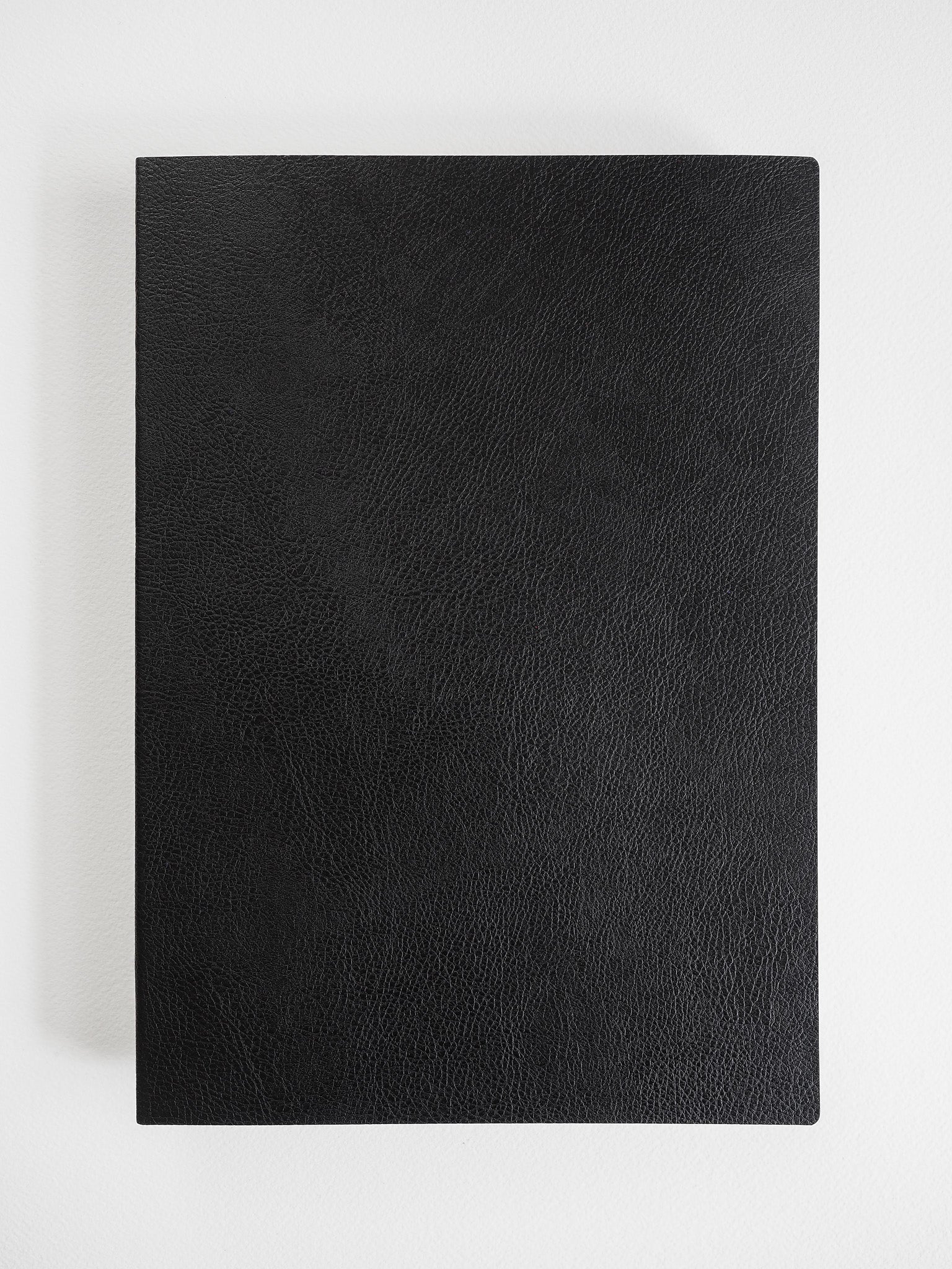 Solid, matte black rectangular cover with a finely textured, subtle grain that provides a sophisticated, deep black aesthetic.