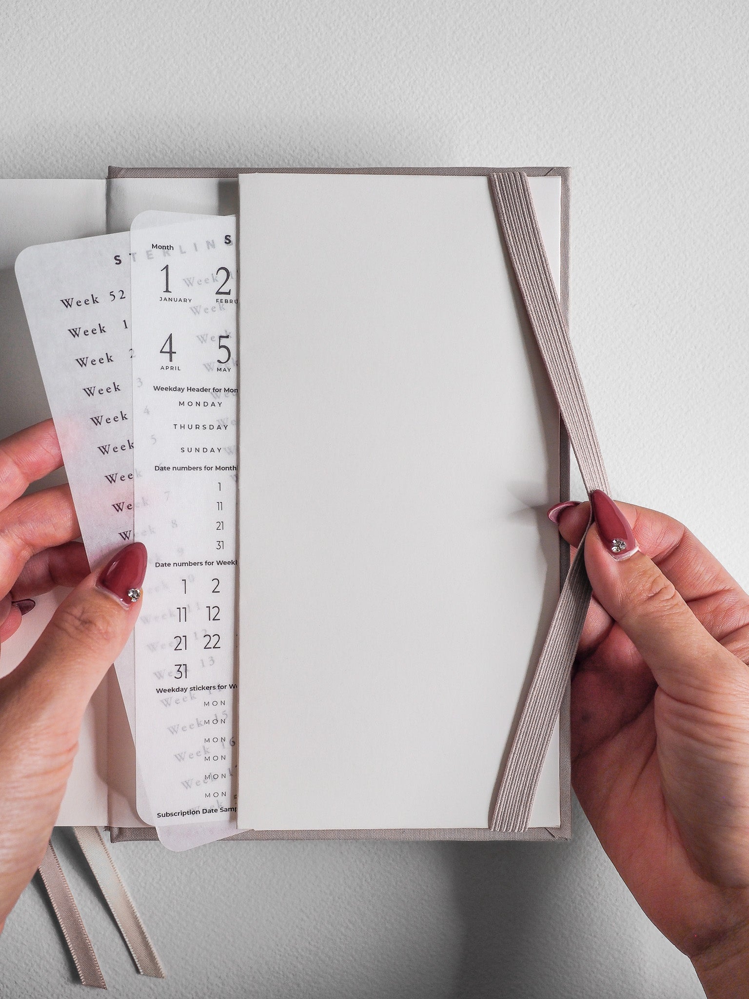 Minimalist B6 hardcover planner diary featuring five years of undated, structured layouts and neutral tones for comprehensive life scheduling.