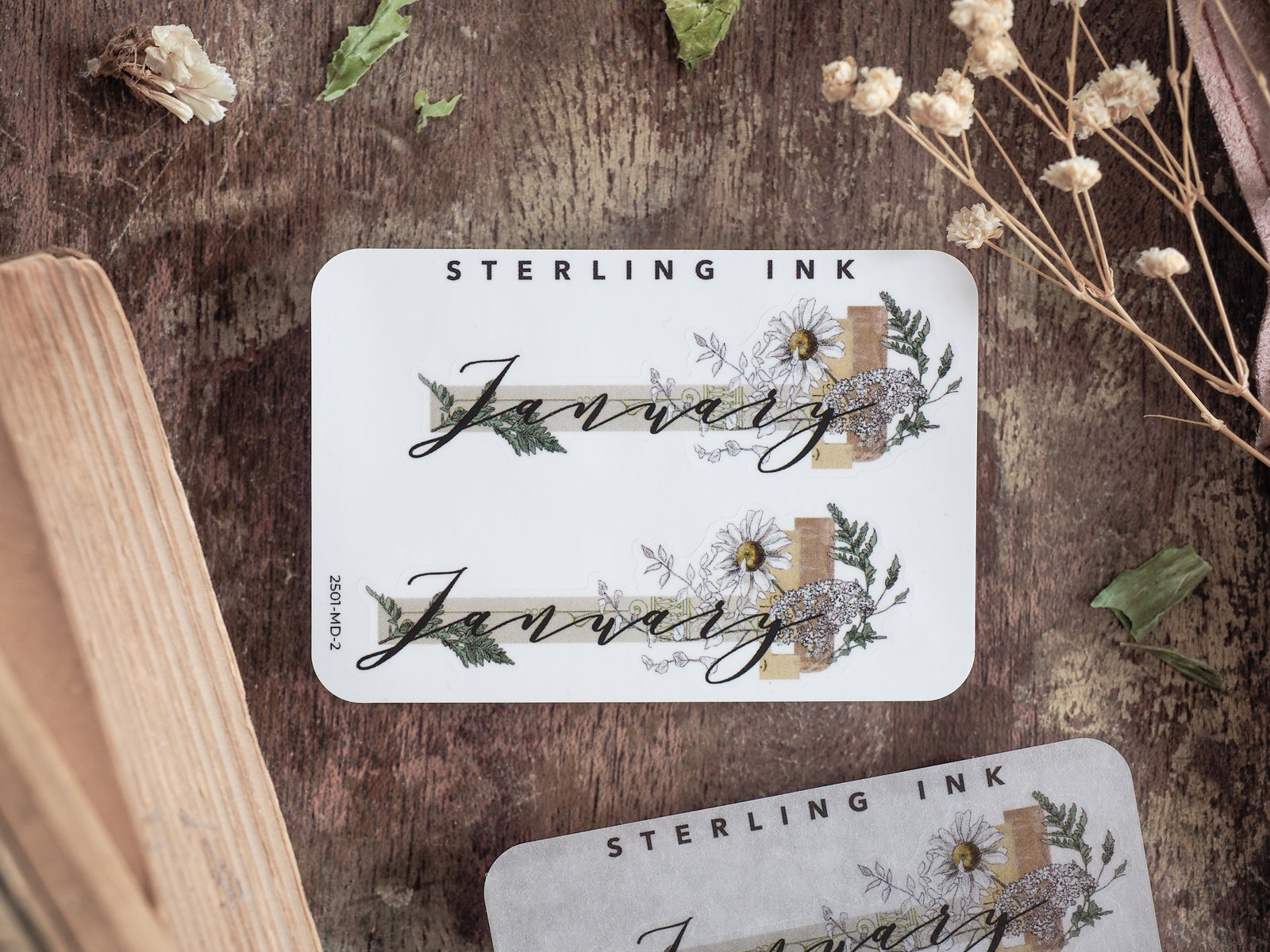 Elegant "January" month sticker featuring botanical wreaths, eucalyptus greenery, and natural floral accents for scrapbooking or journaling.