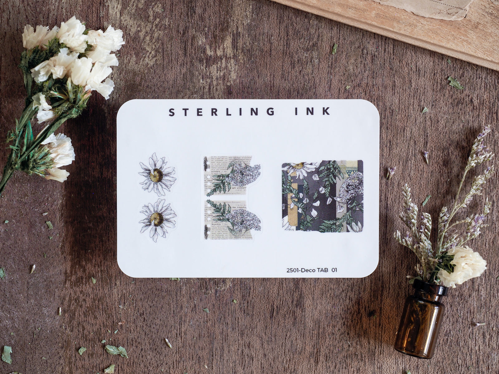 Sterling Ink Deco Tabs featuring floral and botanical designs, including daisy illustrations, patterned foliage, and decorative journaling ephemera on white cardstock.