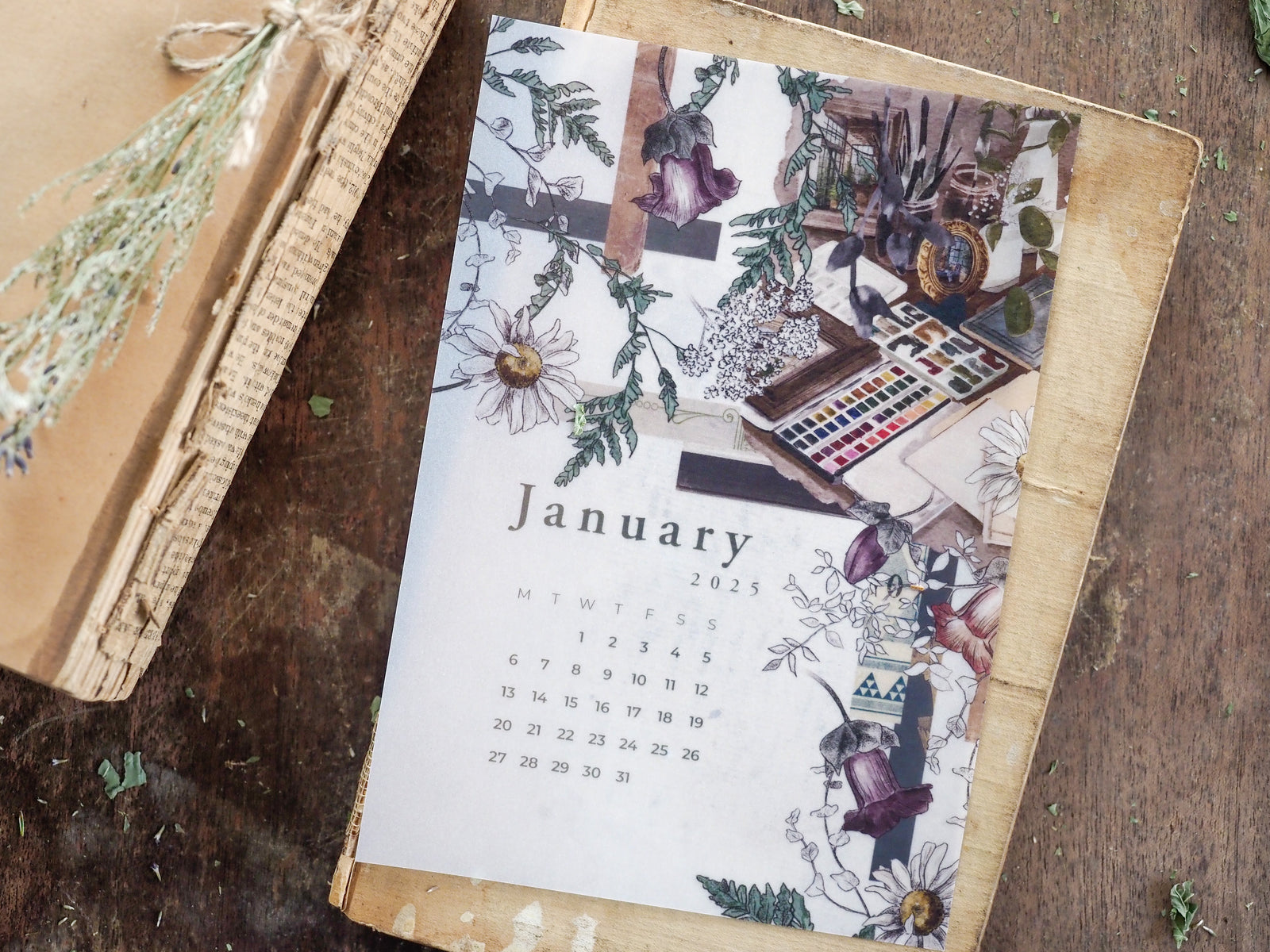 Botanical January 2025 calendar featuring a detailed floral illustration theme with sunflowers, deep purple blossoms, and lush green foliage.