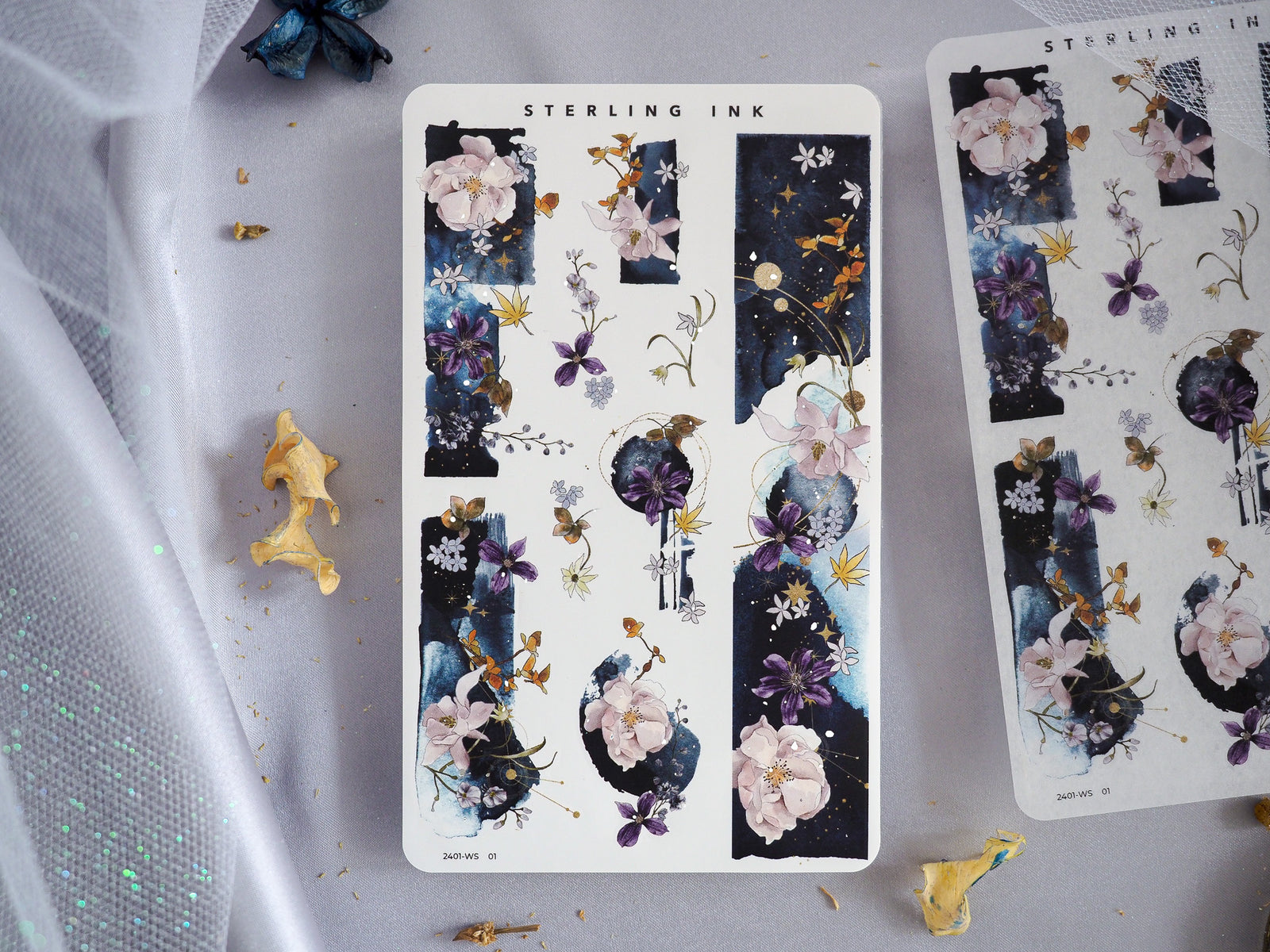 Dark floral washi strip stickers for January 2024, featuring clusters of pastel peonies, roses, and delicate blossoms set against a dramatic dark background with golden accents.