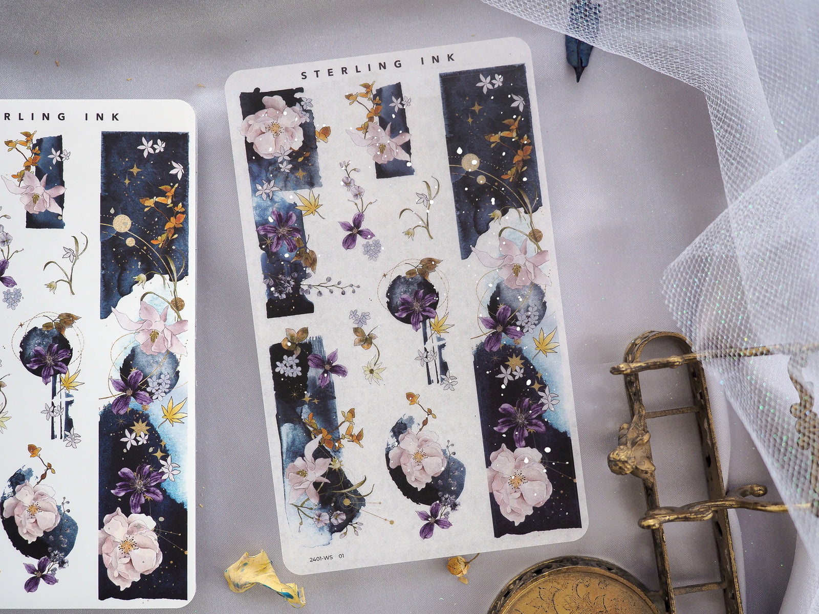 Romantic January 2024 washi strip stickers showcasing delicate watercolor florals and blossoms set against a dark navy and celestial starry night background.