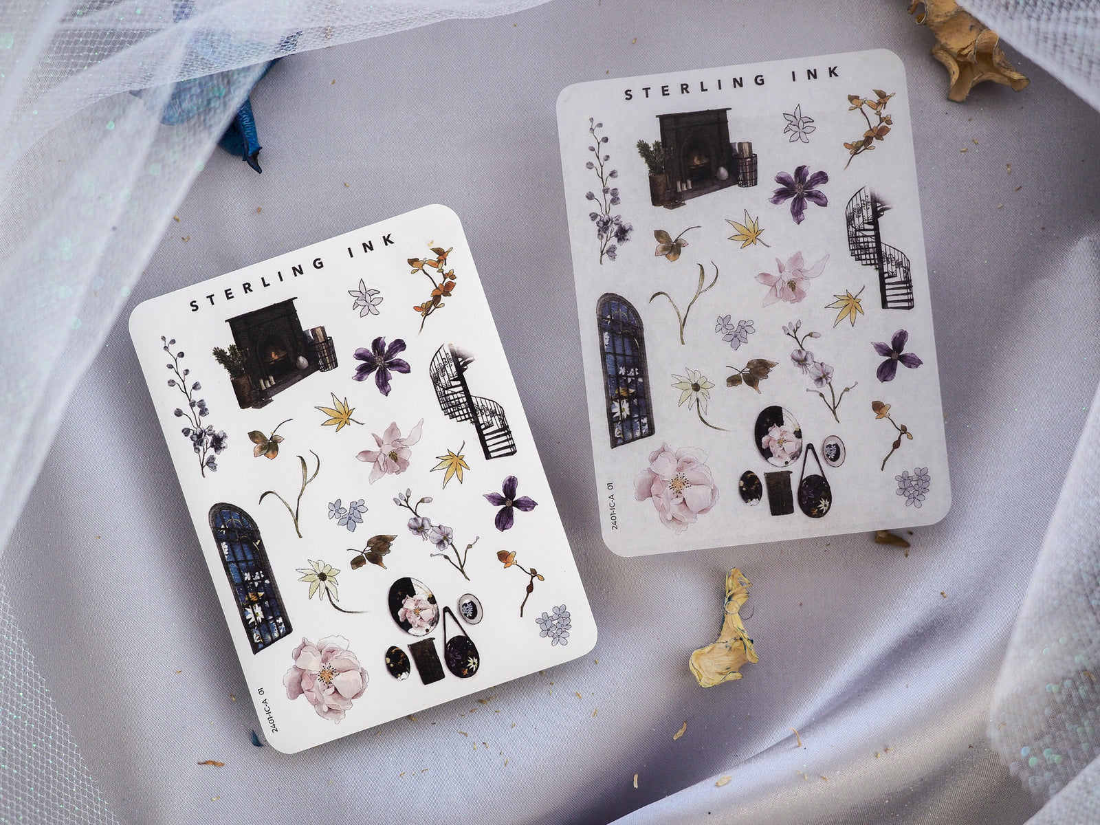 Sheet of mini icon stickers featuring delicate black ink illustrations of architectural arches, floral elements, and decorative motifs for seasonal journaling.