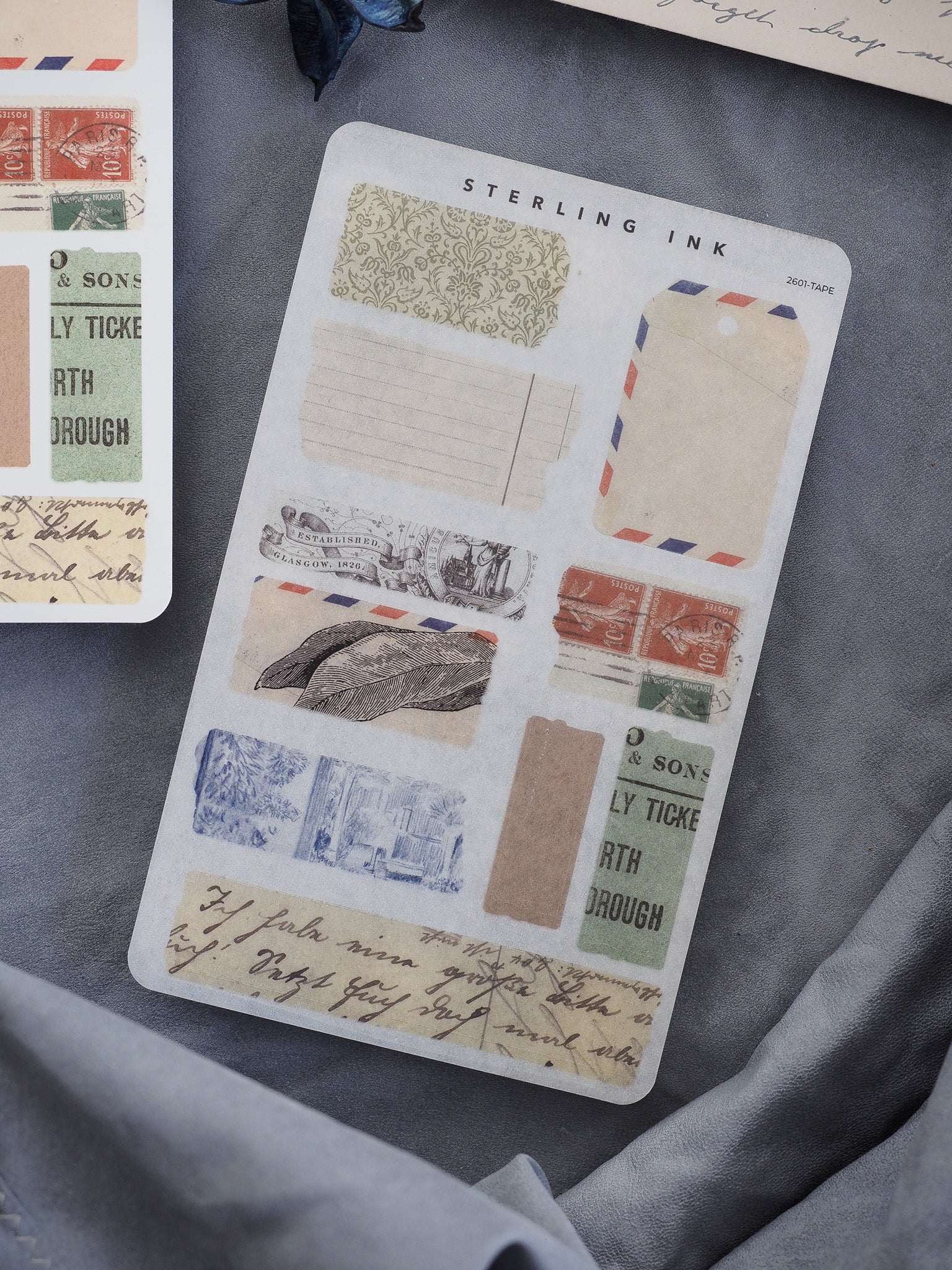 Vintage-themed distressed "torn tape" stickers featuring antique labels, receipts, and faded postal elements in rustic beige and sepia tones for journaling.