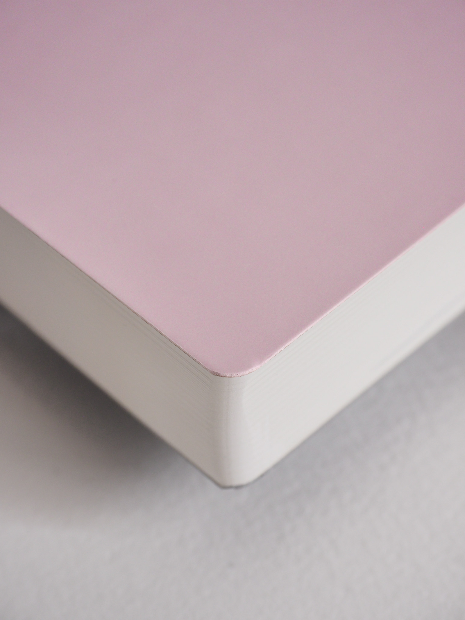 Elegant blush pink A5 vertical planner for 2026, featuring a smooth, solid matte cover ideal for year-long organization.