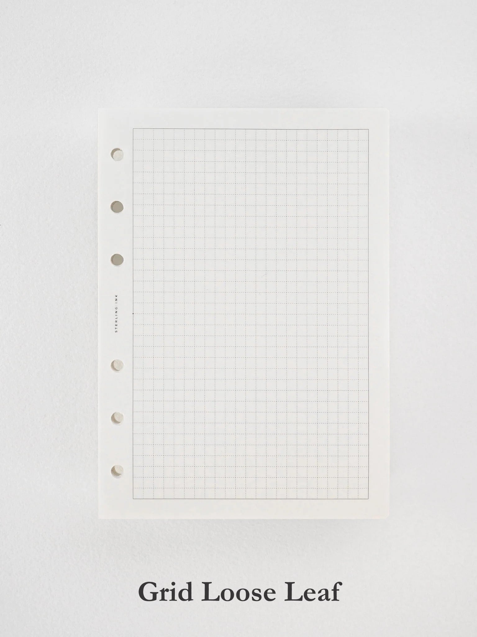 Pristine white loose leaf paper displaying a fine, light gray grid pattern, perfectly suited for drawing, academic planning, and detailed note-taking.