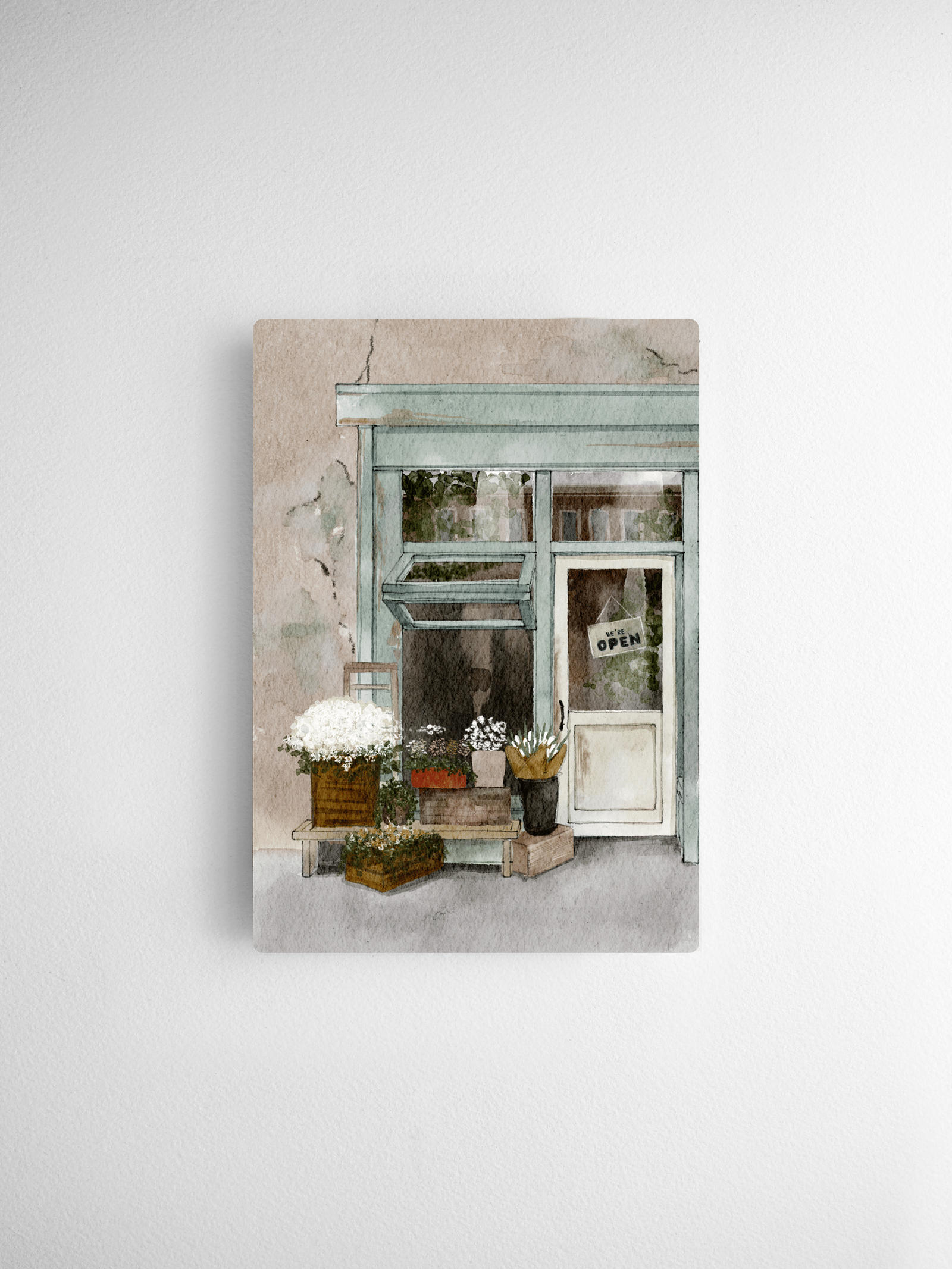 Charming watercolor illustration of a quaint, rustic storefront featuring soft pastel trim, potted blooms, and a vintage "OPEN" sign.