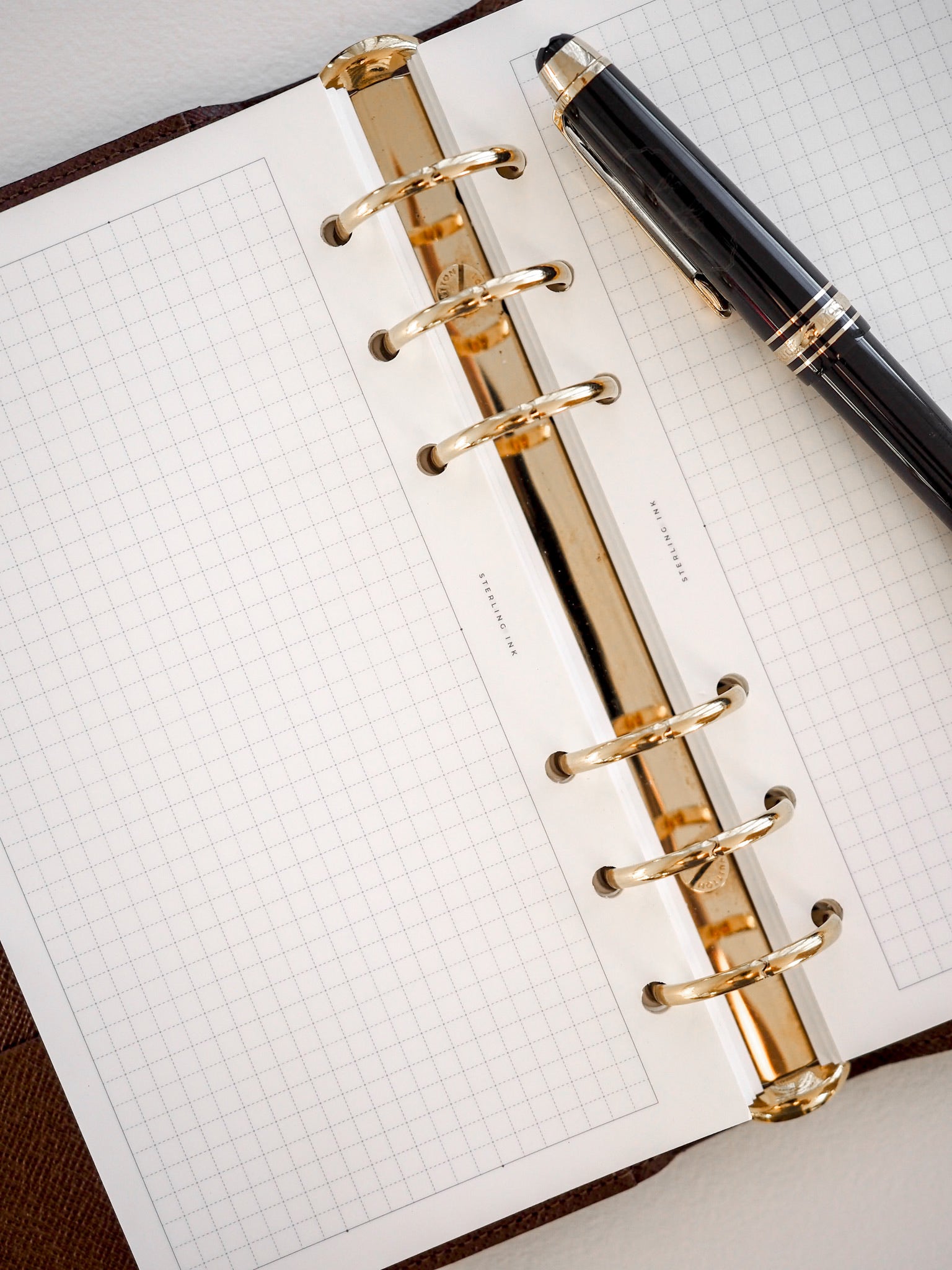 Spiral-bound writing pad featuring Tomoe River grid paper with precise 3.7mm graph lines, perfect for detailed note-taking or drafting technical sketches.