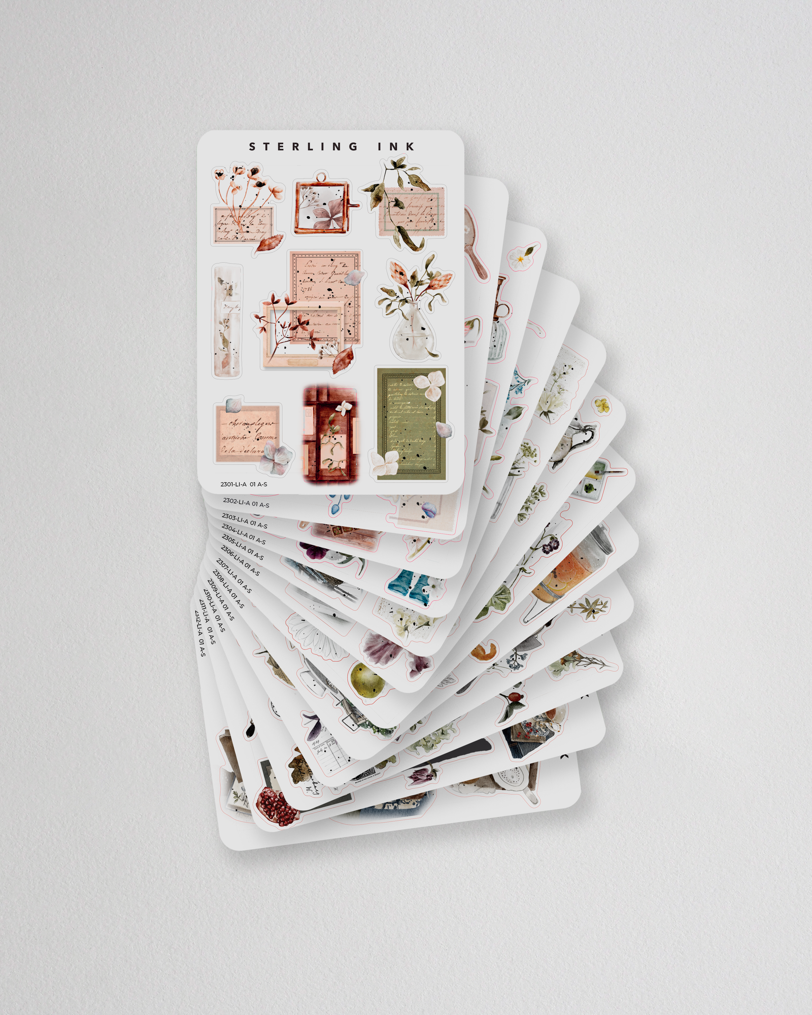 Annual collage sticker set featuring twelve monthly designs of vintage ephemera, delicate florals, and scrapbooking elements for journaling and planning.