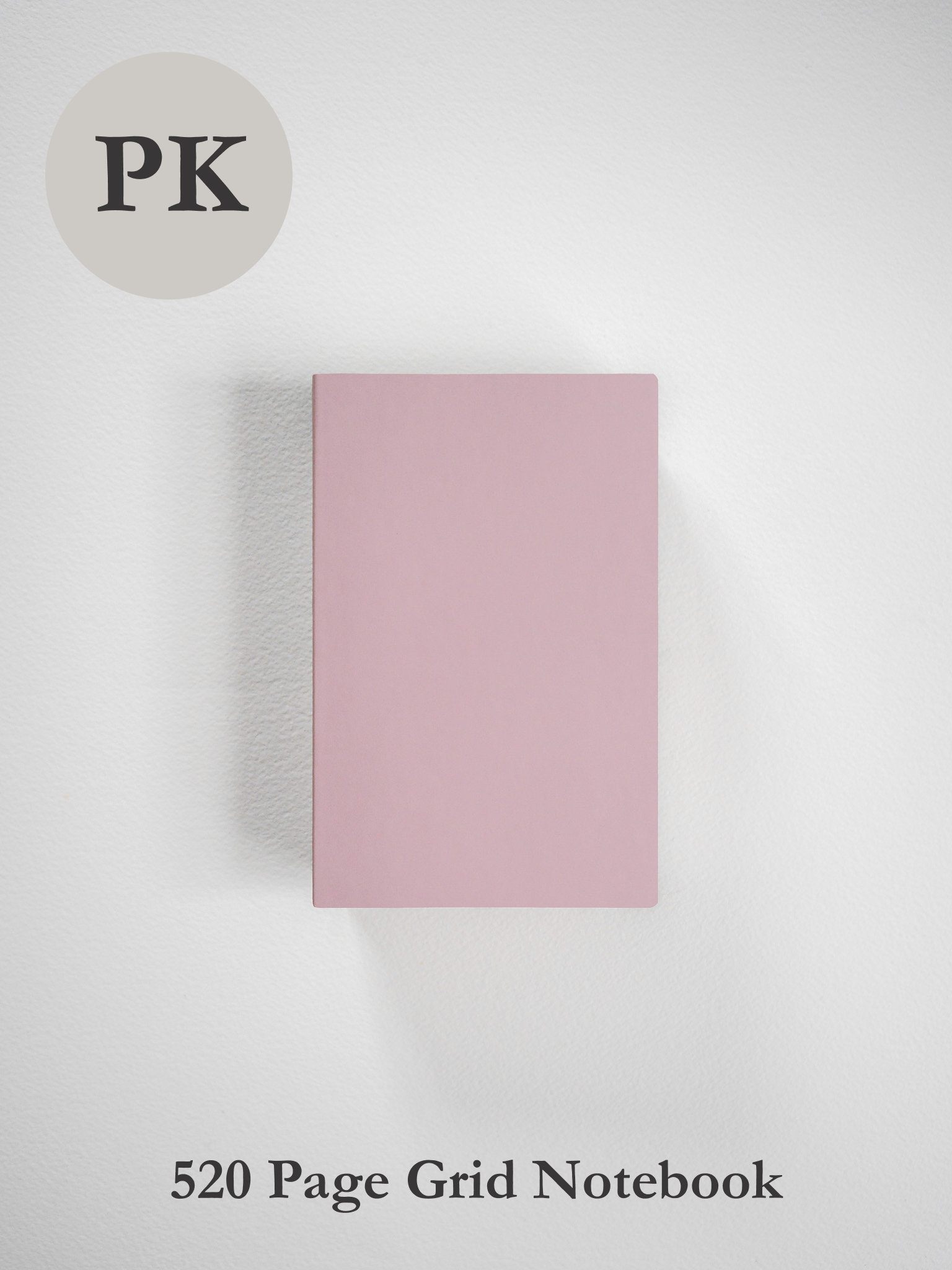A pale blush pink pocket notebook designed for writing, featuring 520 pages of professional grid ruling.