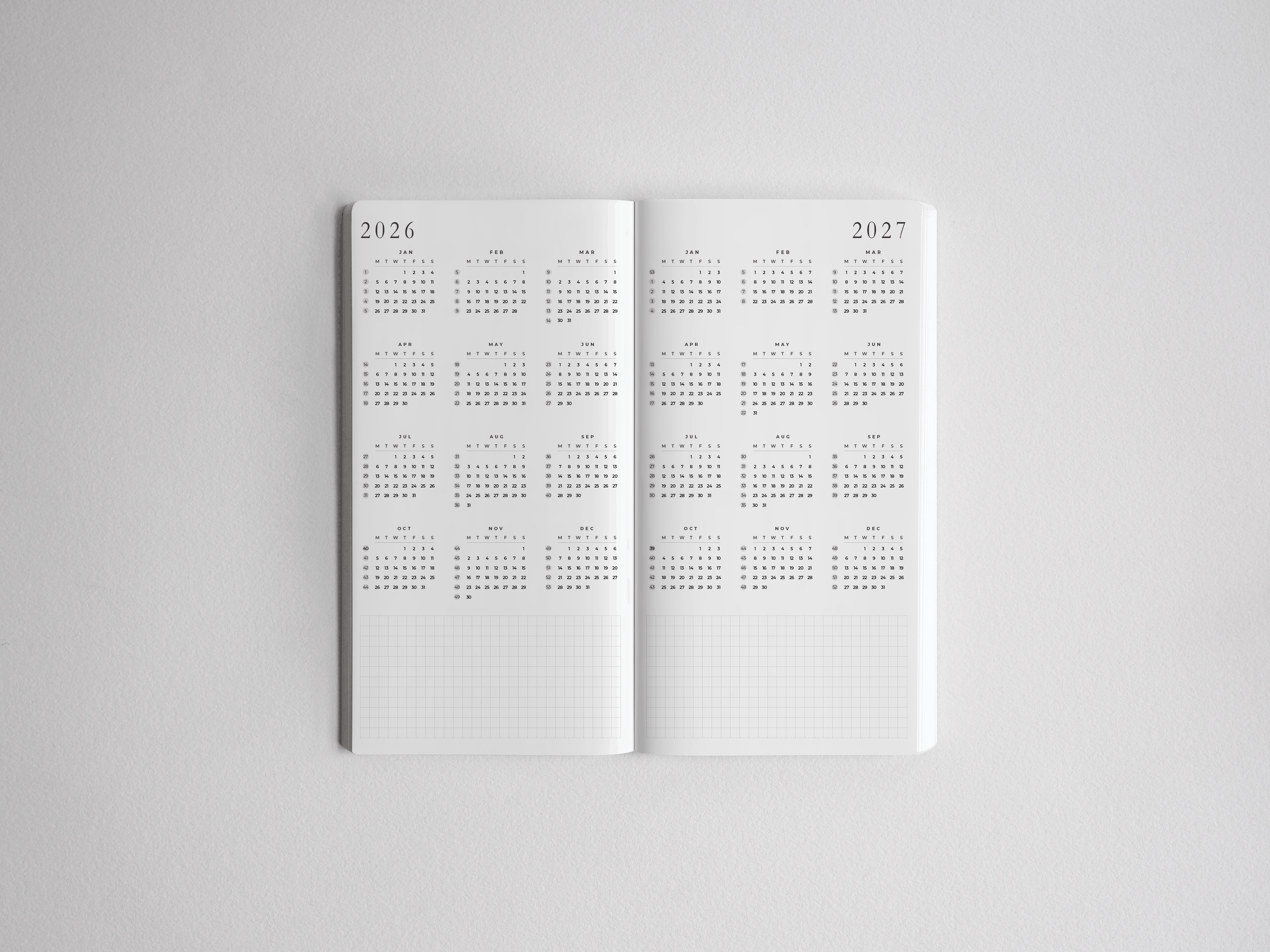 Open academic planner featuring structured, vertically aligned scheduling pages for 2026 and 2027, designed for comprehensive full-year academic tracking.
