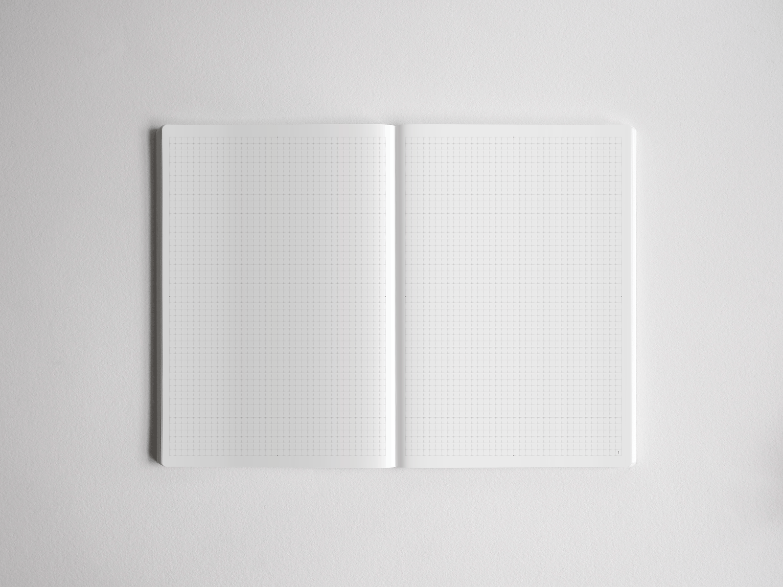 Open academic planner showcasing two A5 pages densely covered in light gray grid lines, perfect for structured journaling or note-taking.