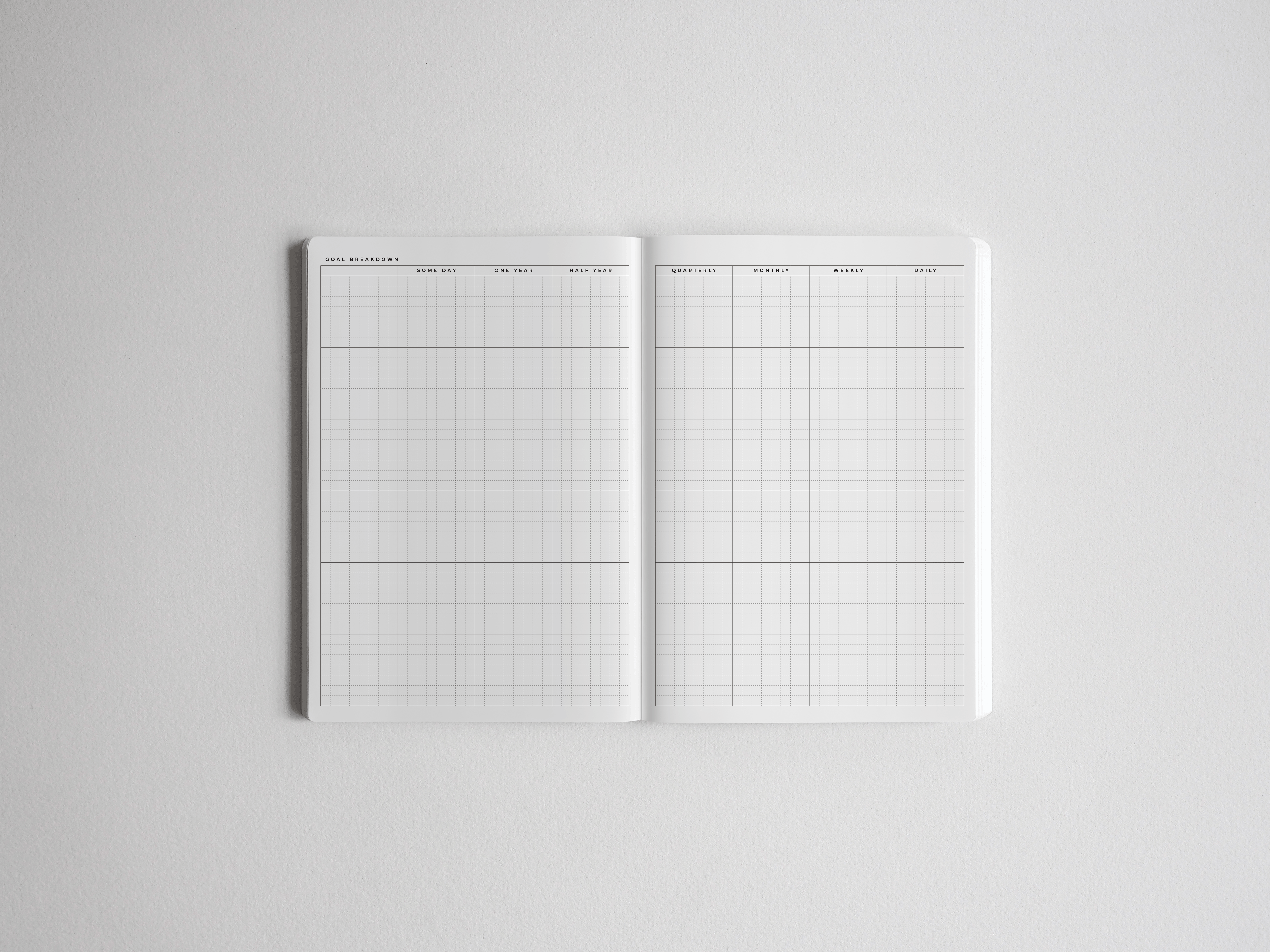 Open B6 academic planner showing a clean, gridded, vertical layout designed for comprehensive goal breakdown, quarterly, monthly, and daily planning organization.