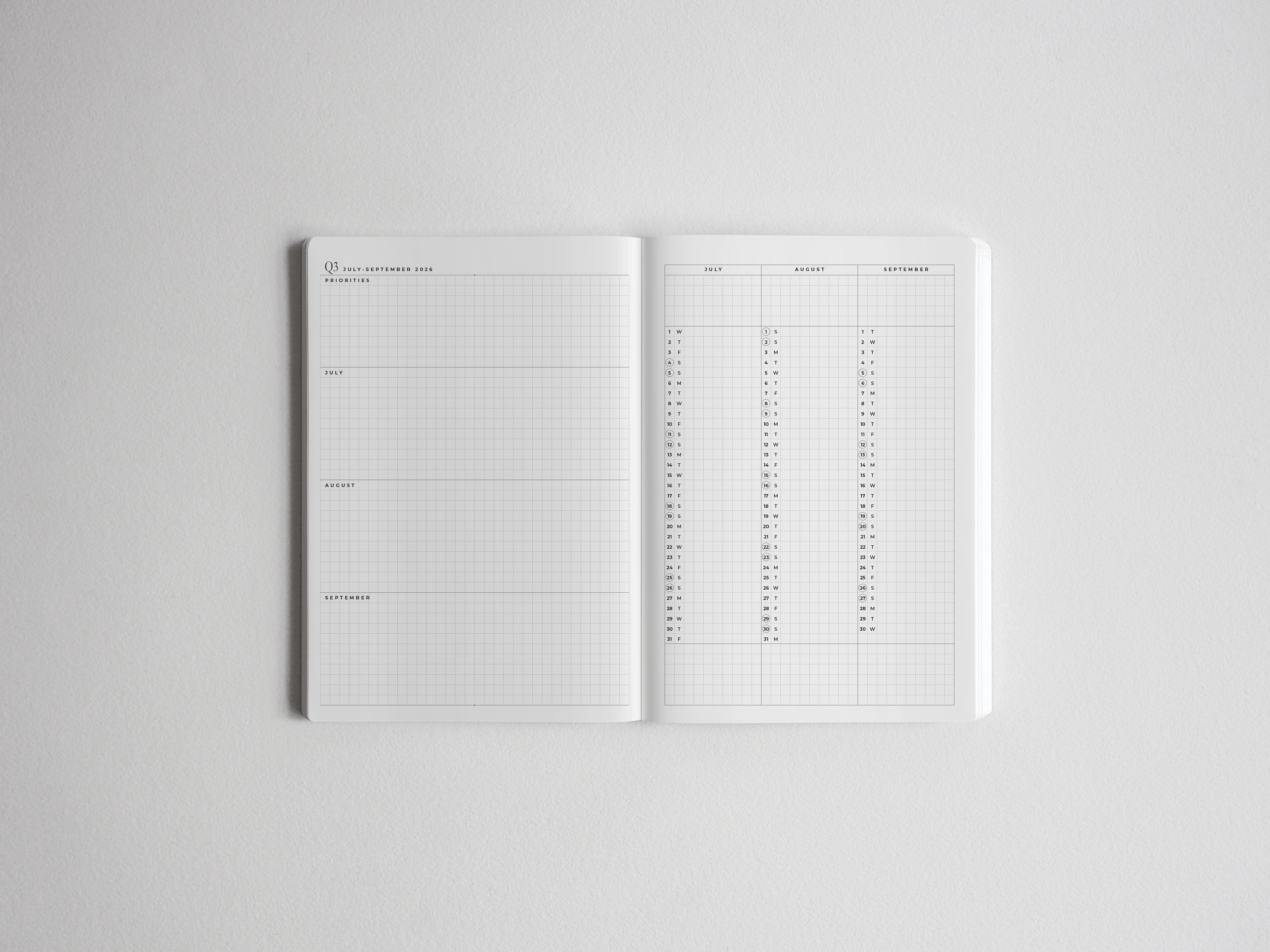Open academic planner displaying highly structured, white pages with vertical grids and scheduled sections for planning the 2026-2027 school year.