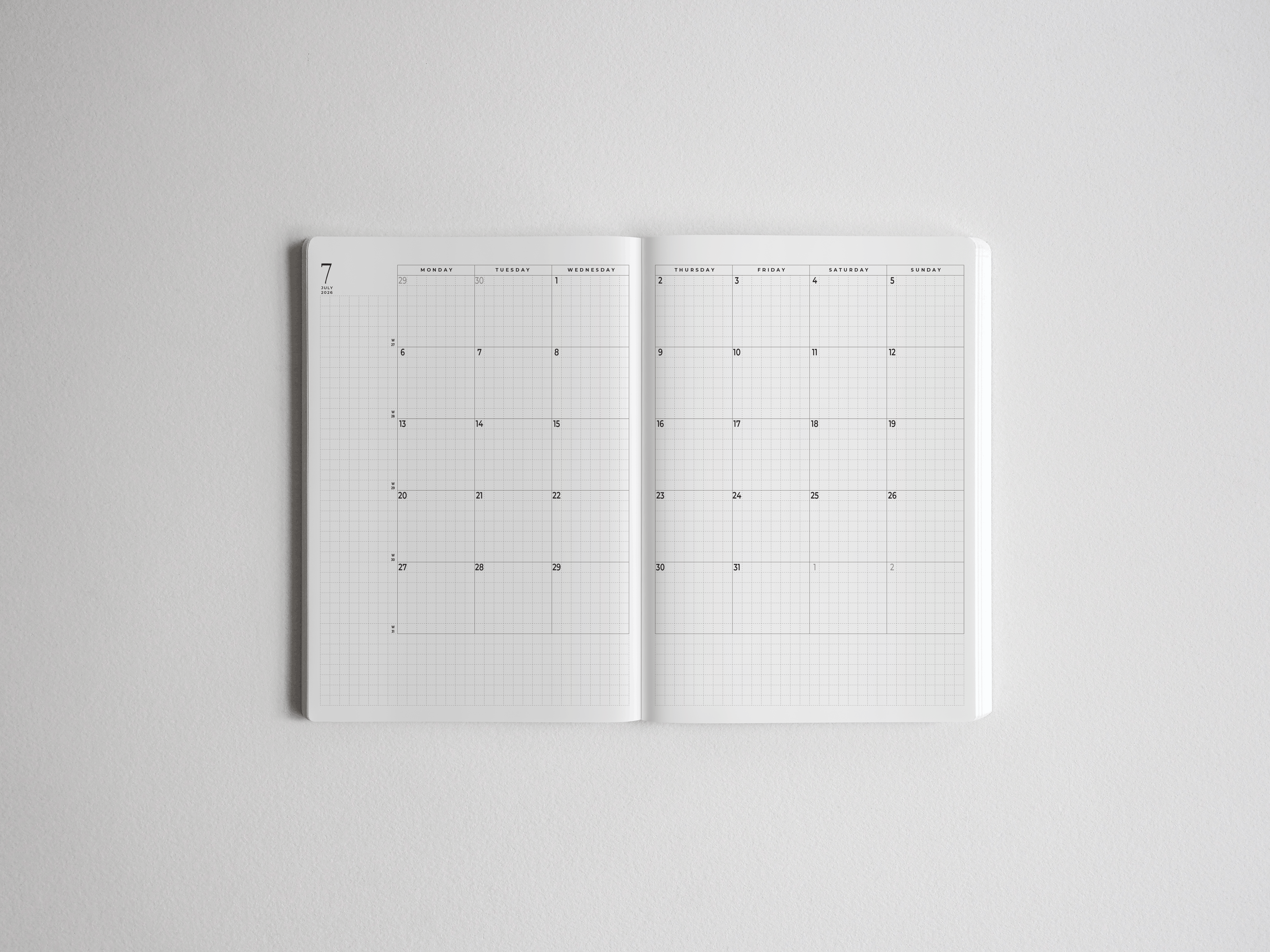 Open B6 academic planner featuring clean, functional white grid layouts and dedicated vertical scheduling sections for tracking the 2026-2027 school year.