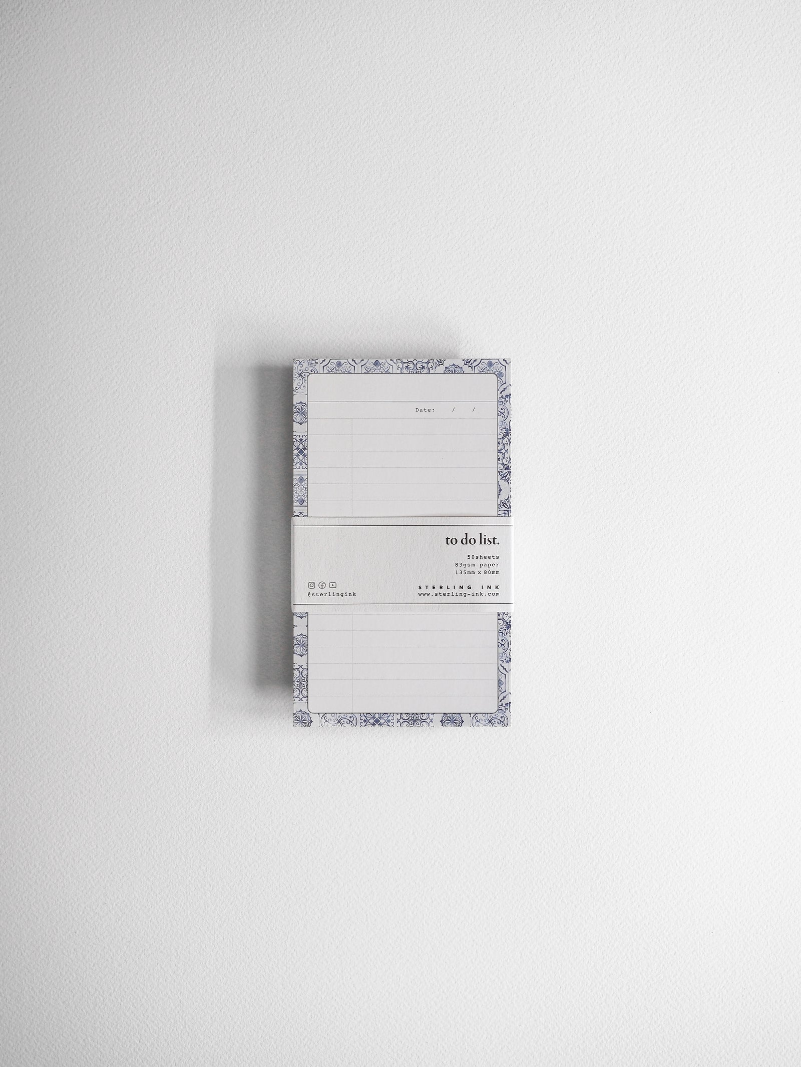 Elegant to-do list notepad featuring ruled lines and a decorative, detailed damask border design for planning and organization.