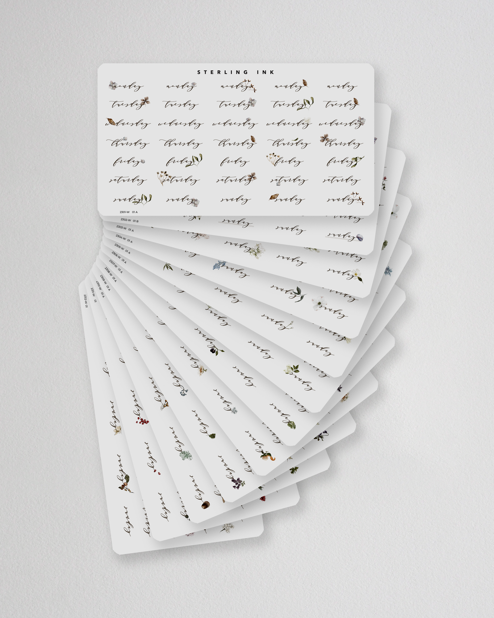Elegant botanical sticker set designed for journaling, featuring muted florals and weekly date trackers for year-long planning.