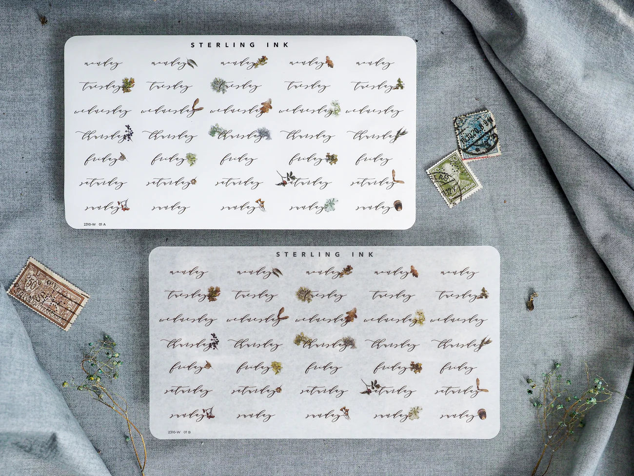 Elegant set of nine small, square stickers featuring repeating black ink floral and stylized script motifs, designed for planning or calendar embellishment.