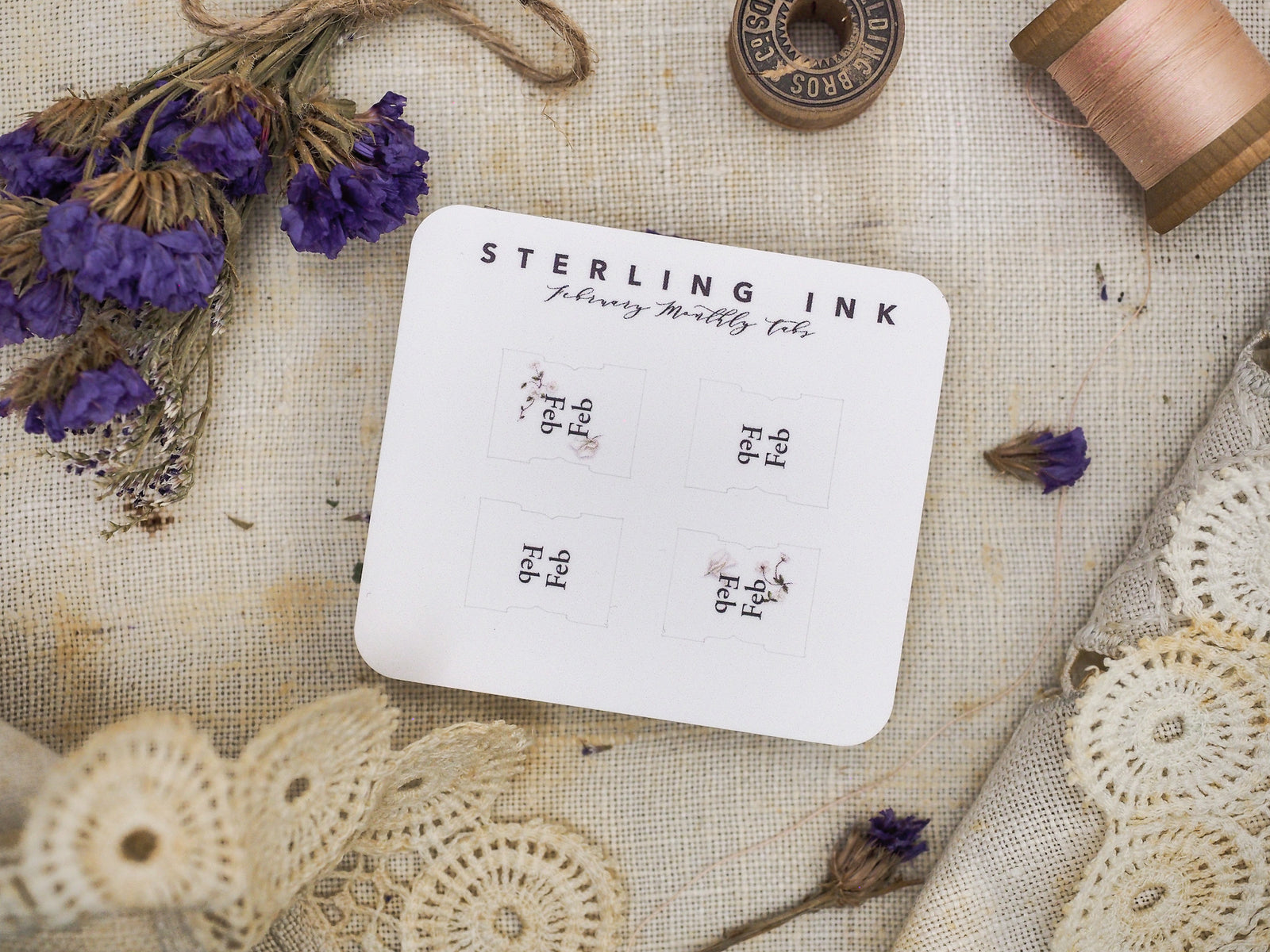 White monthly tab card for planning, branded "Sterling Ink," featuring six structured fields ready for February journaling or calendar organization.