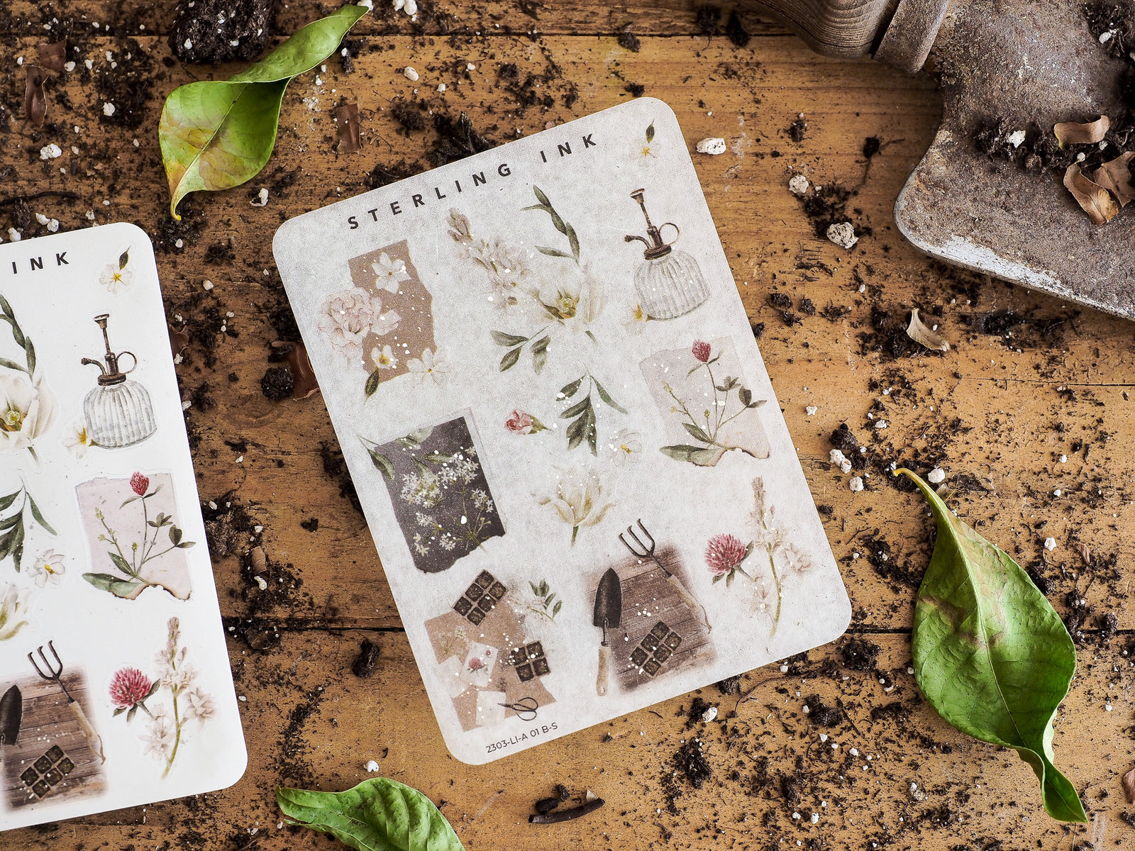 A sticker collection featuring muted botanical patterns, delicate dried flowers, and vintage illustrations of rustic homes and ornate vases.