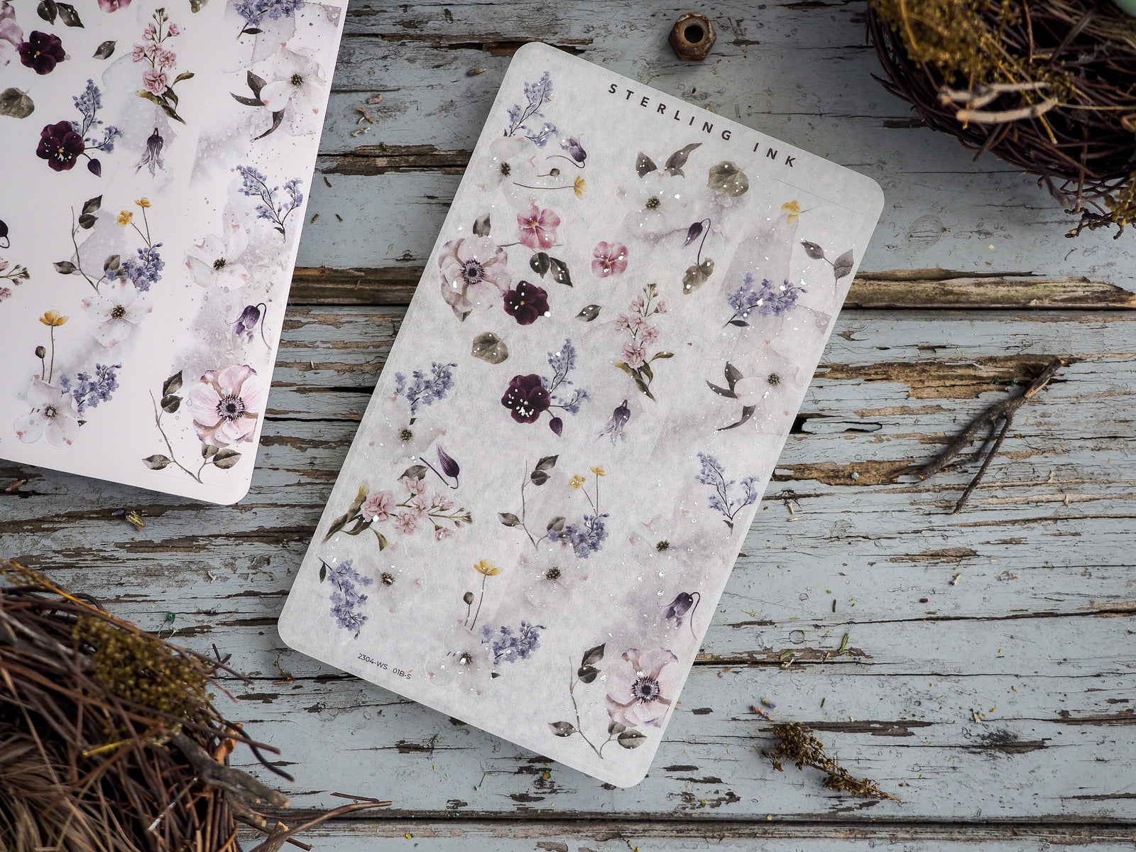 Delicate sticker sheets featuring vintage botanical illustrations of pale pink, dusty purple, and cream floral bouquets mixed with lush foliage.