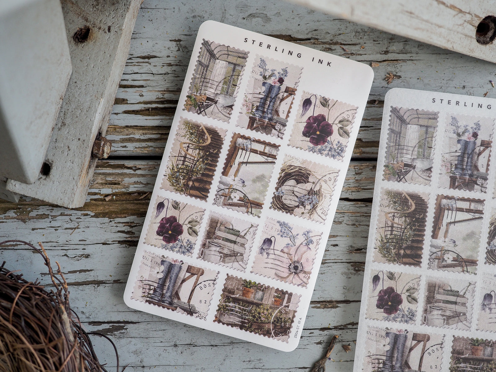 Sheet of detailed vintage scrapbook stickers featuring muted florals, antique architectural elements, and charming scenes of ornate furniture.