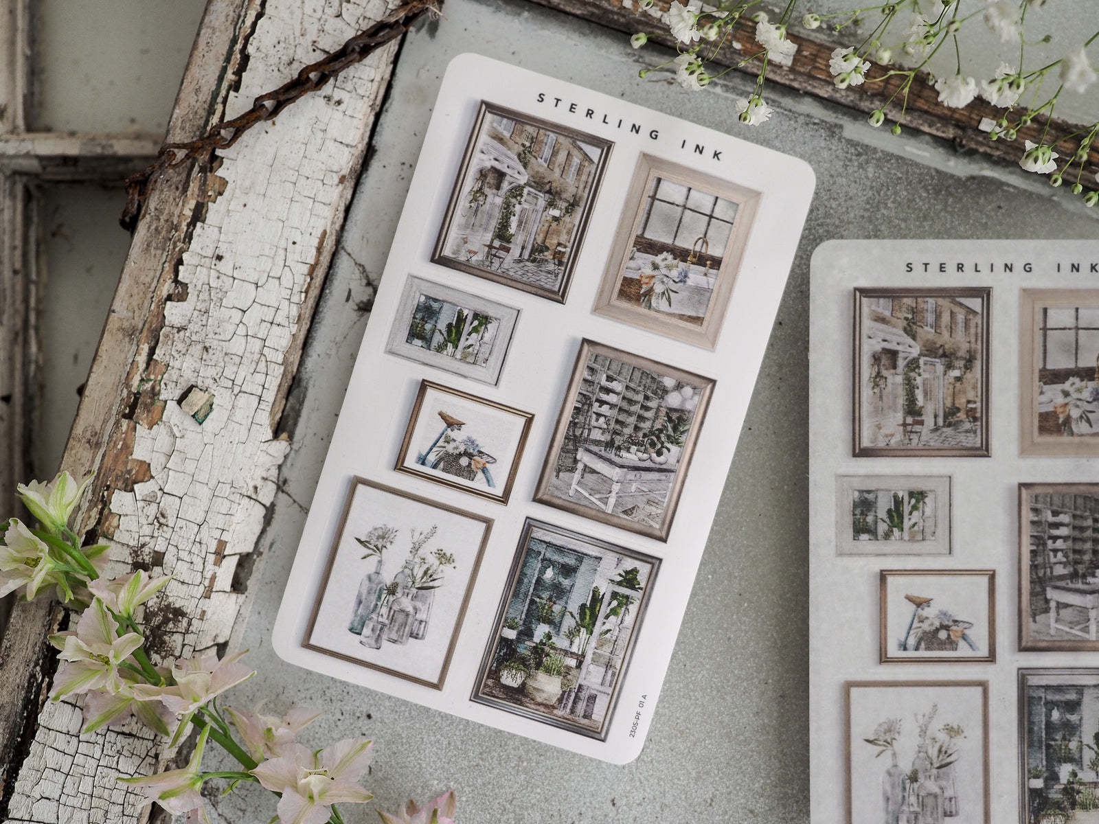 White sticker sheet featuring a collection of miniature decorative picture frames containing various aesthetic prints of vintage buildings and urban street scenes.