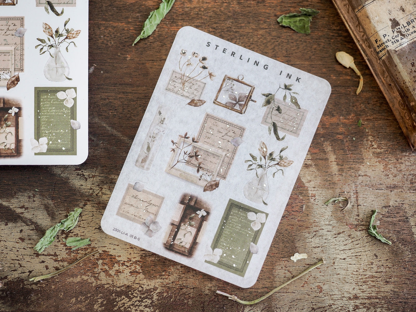 Vintage botanical sticker sheet featuring sepia-toned icons, ornate document frames, and floral illustrations with elegant foil accents for journaling and crafts.