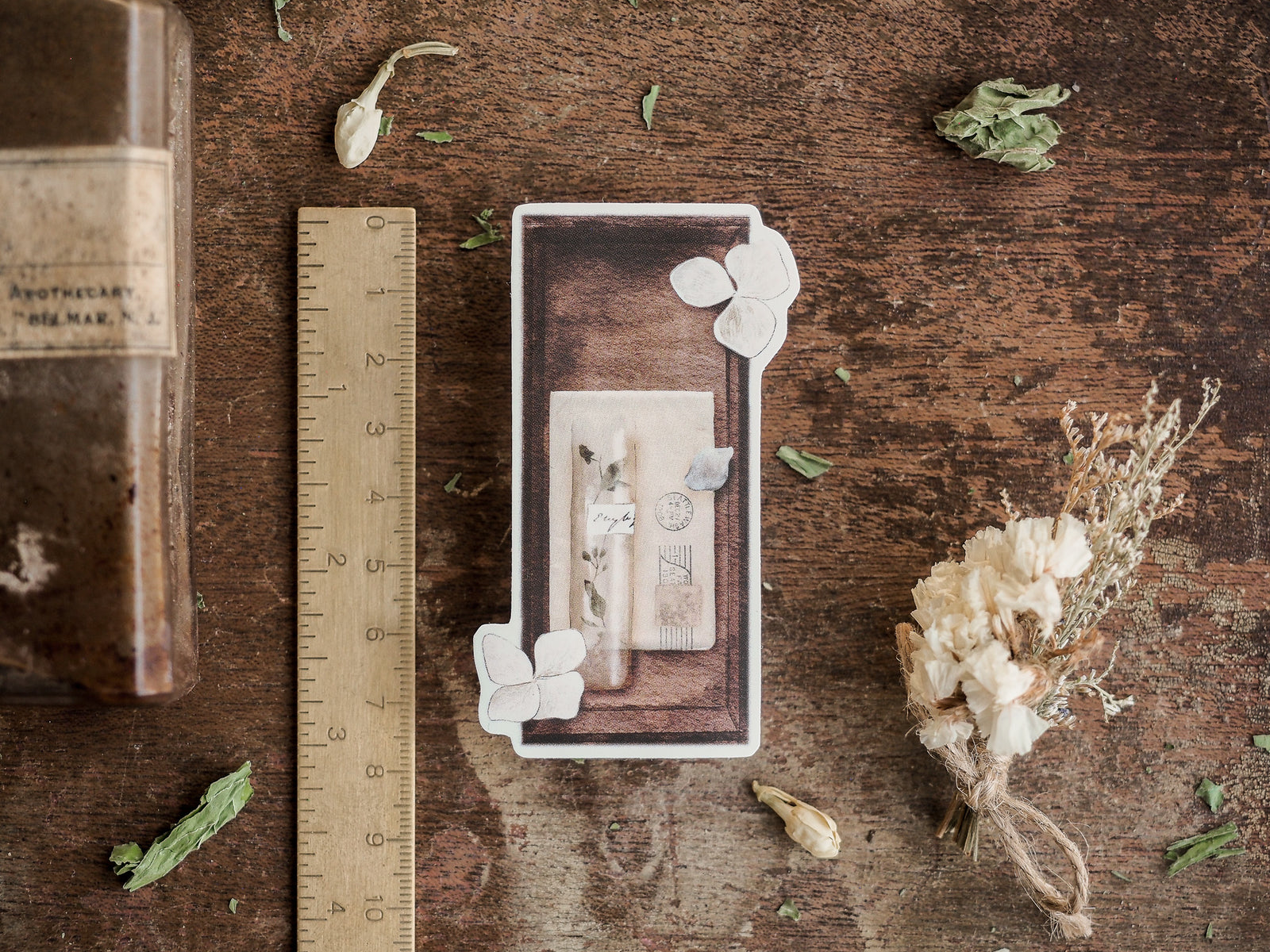 Sepia-toned botanical sticker design featuring dried herbs, delicate white blossoms, and antique apothecary illustrations suitable for seasonal journaling.