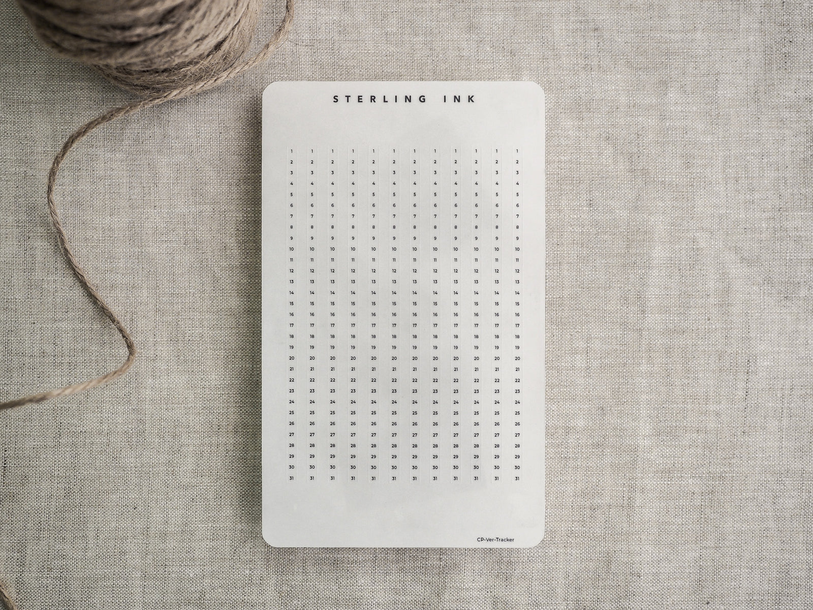 White, structured tracker strip featuring a clean, numbered grid layout for planning and daily scheduling, designed for compatibility with common planners.
