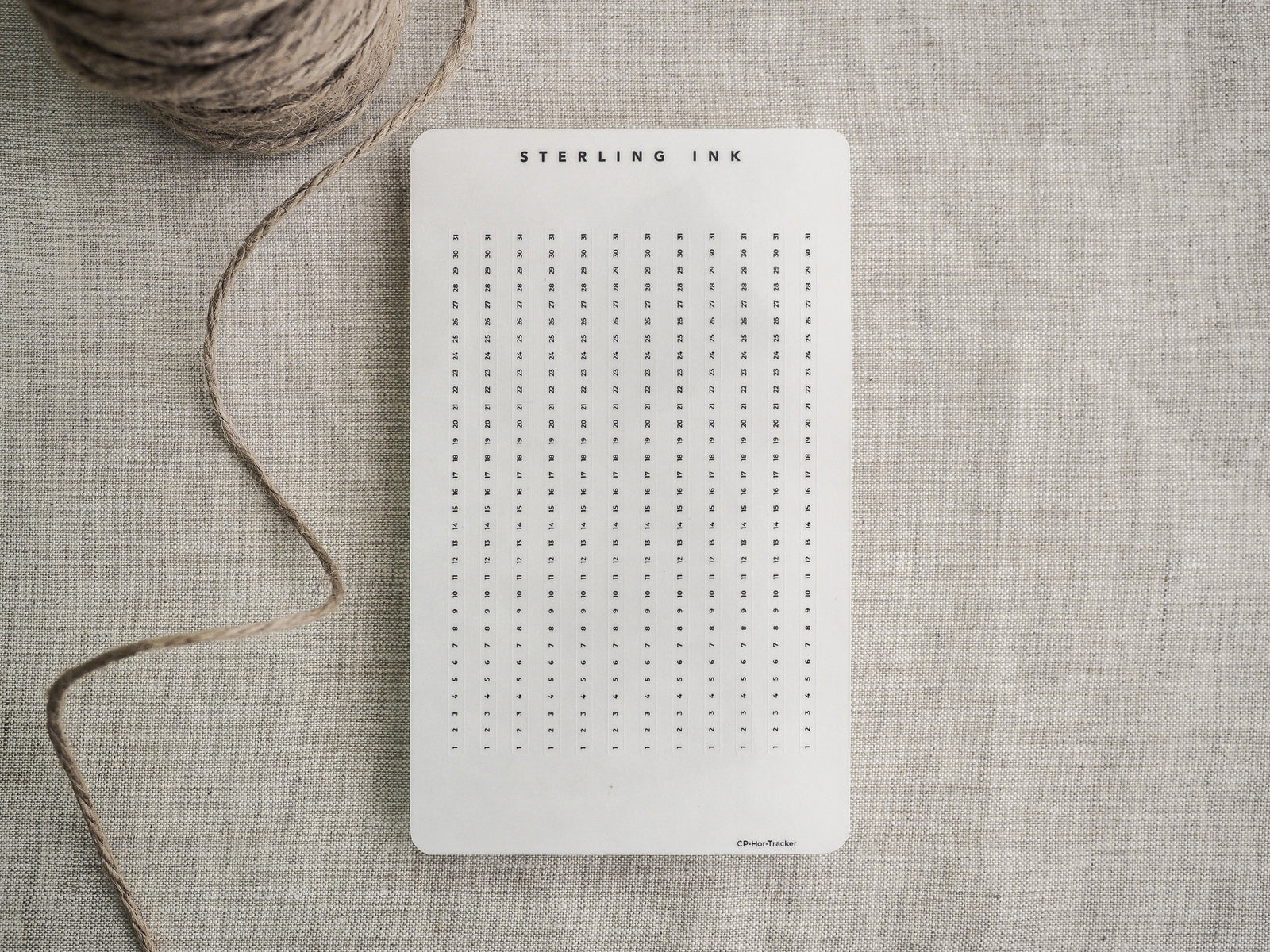 White planner tracker strips featuring "Sterling Ink" branding and organized grids perfect for customizable vertical and horizontal goal or habit tracking.
