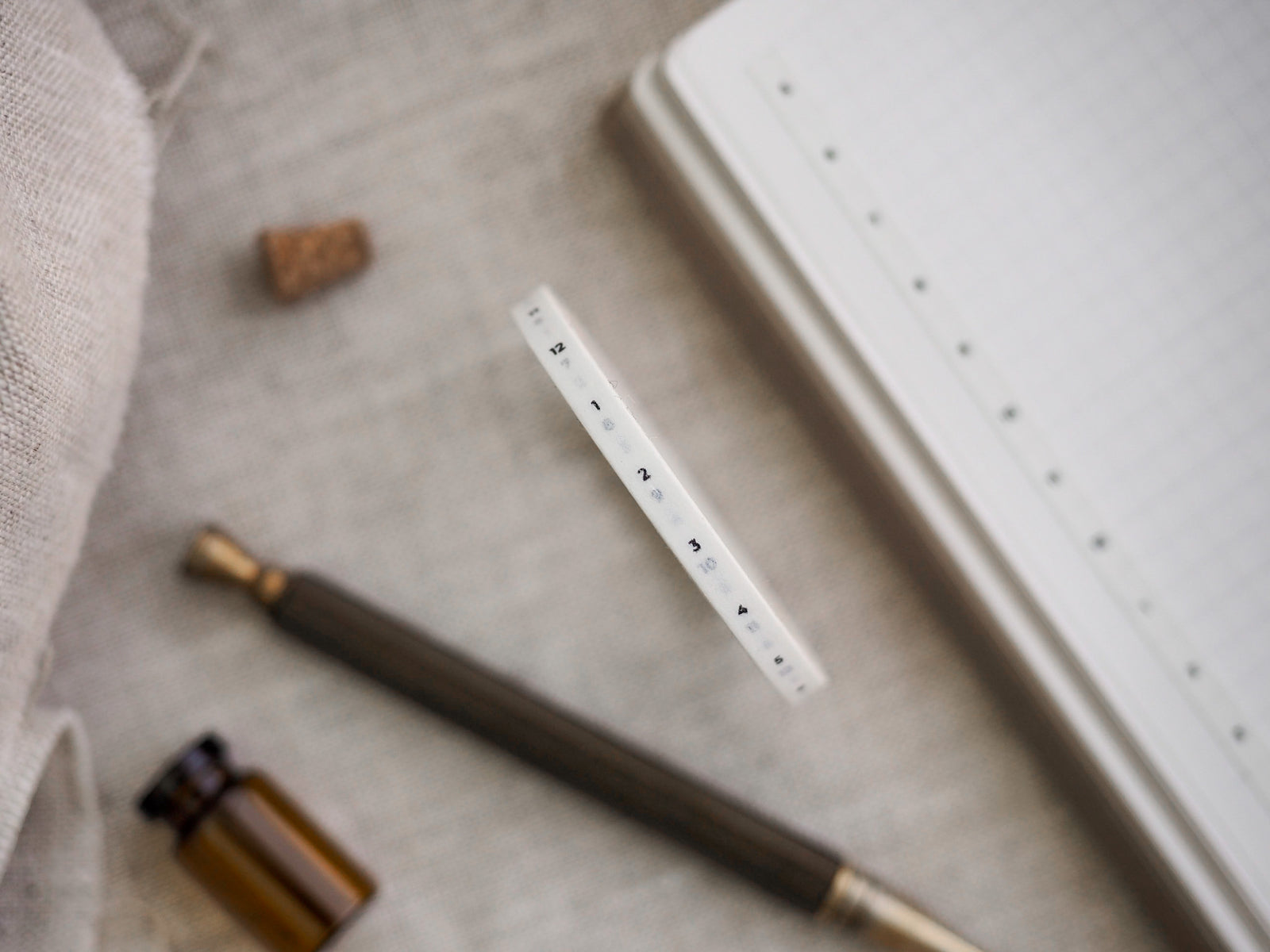 Minimalist white washi tape printed with a clear hourly timeline (numbers 1 through 12) for marking schedules, planners, and organization.