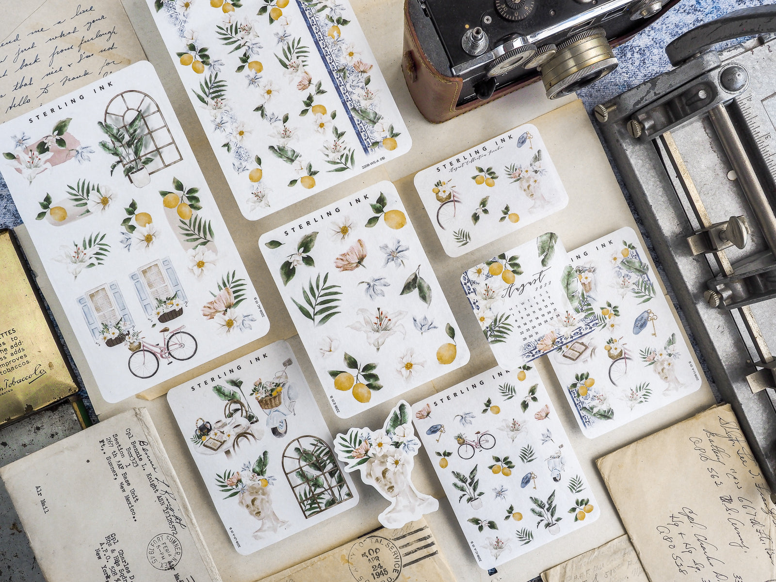 Botanical sticker sheet with realistic yellow lemons, green leaves, and detailed rustic floral illustrations perfect for