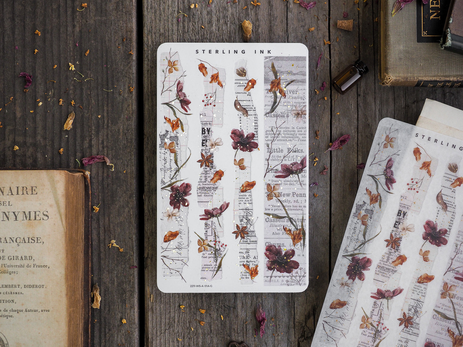 Cream-toned washi strips adorned with delicate, vintage botanical prints and sketches of dried flora in sepia, burgundy, and earthy tones.